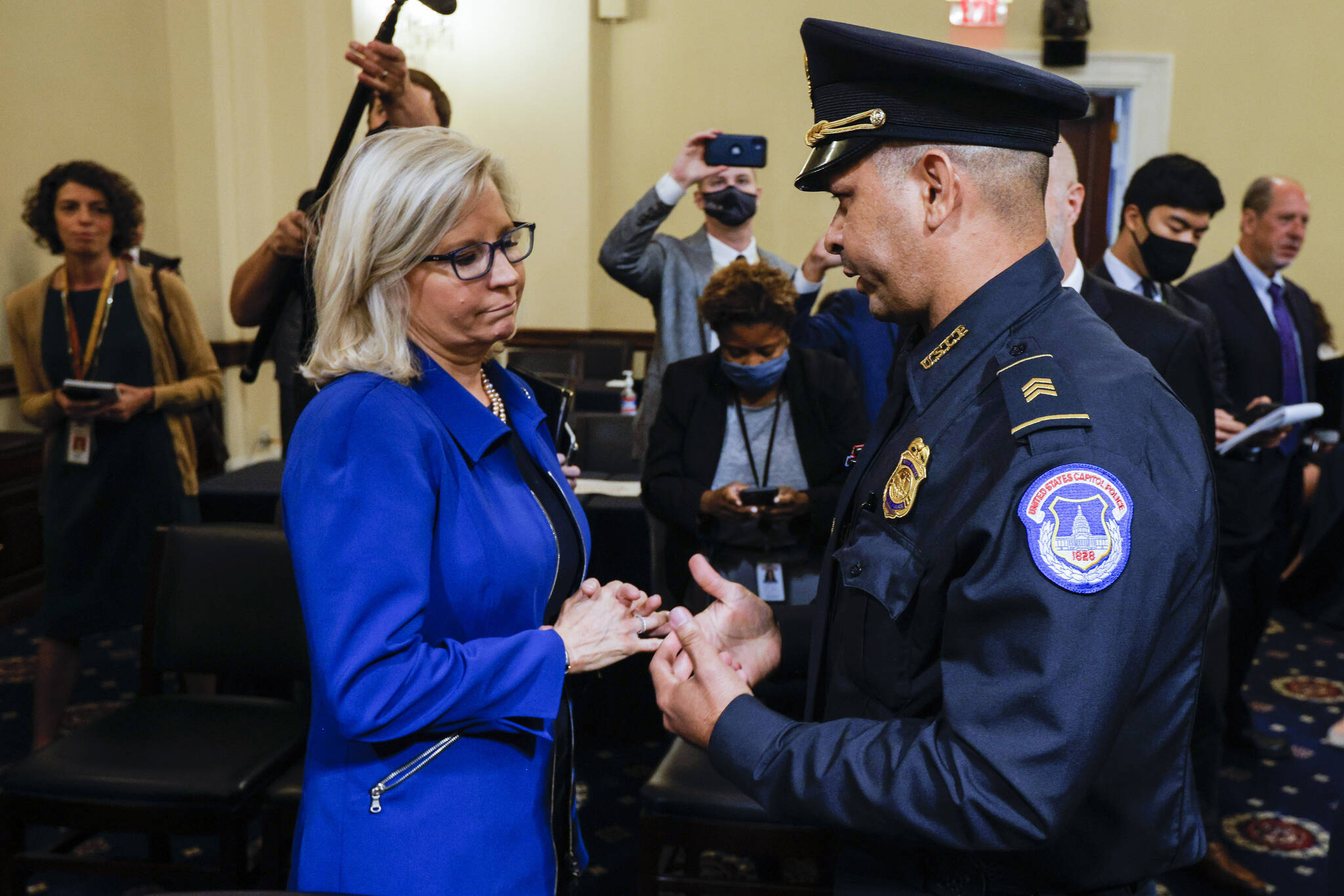 Rep. Liz Cheney, R-Wyo., speaks with U.S. Capitol Police Sgt. Aquilino Gonell after a House select committee hearing on the Jan. 6 attack on Capitol Hill in Washington, on July 27, 2021. (Jim Bourg/Pool via AP, File)