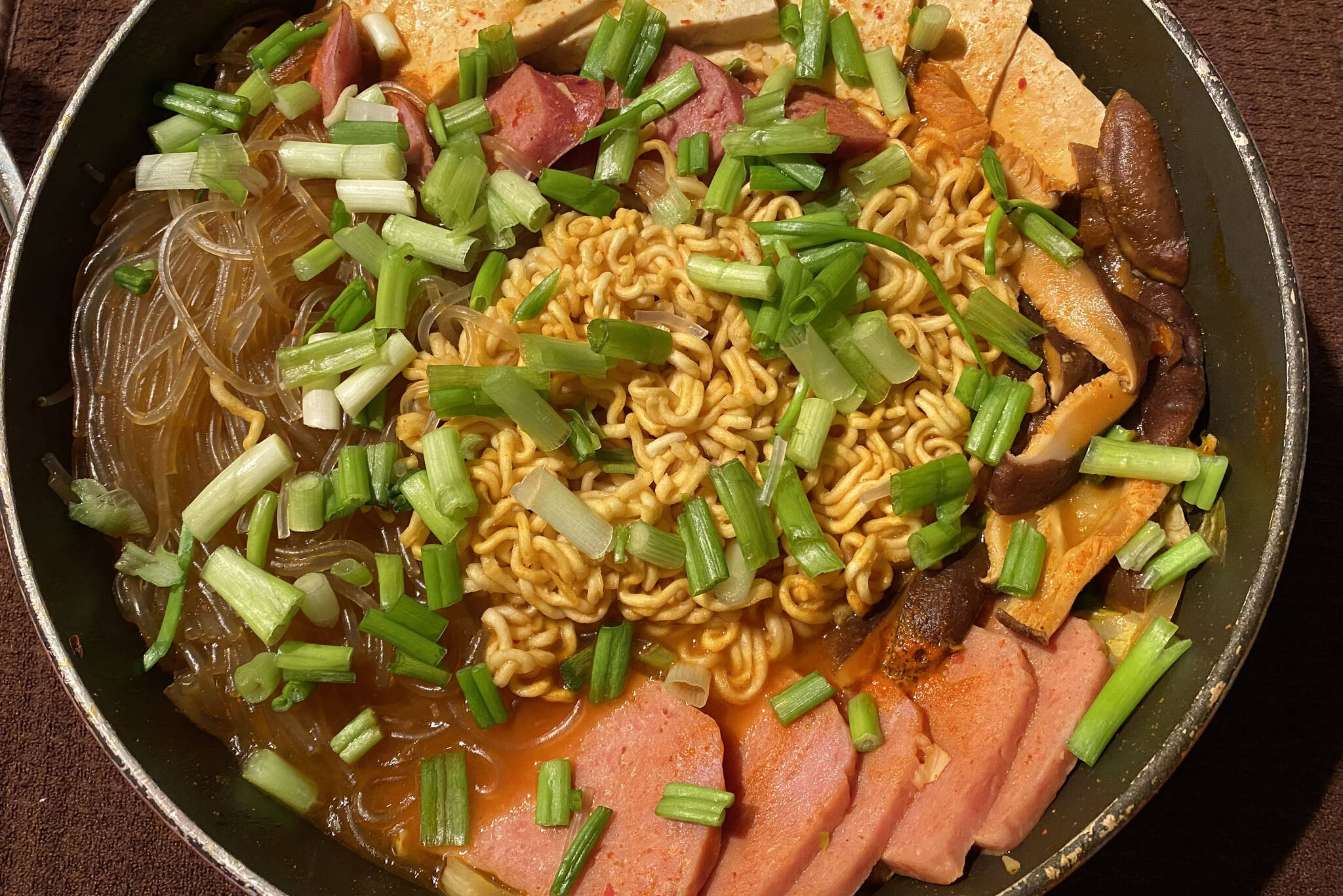 Traditional ingredients like kimchi, ramen and tofu are mixed with American comfort food Spam in this hearty Korean stew. (Photo by Tressa Dale/Peninsula Clarion)