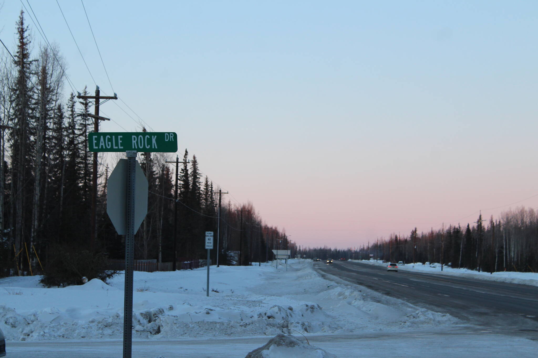 Cars drive along the Kenai Spur Highway near Eagle Rock Drive on Tuesday, Jan. 4, 2021 near Kenai, Alaska. The highway will be widened under a state transportation project. (Ashlyn O’Hara/Peninsula Clarion)