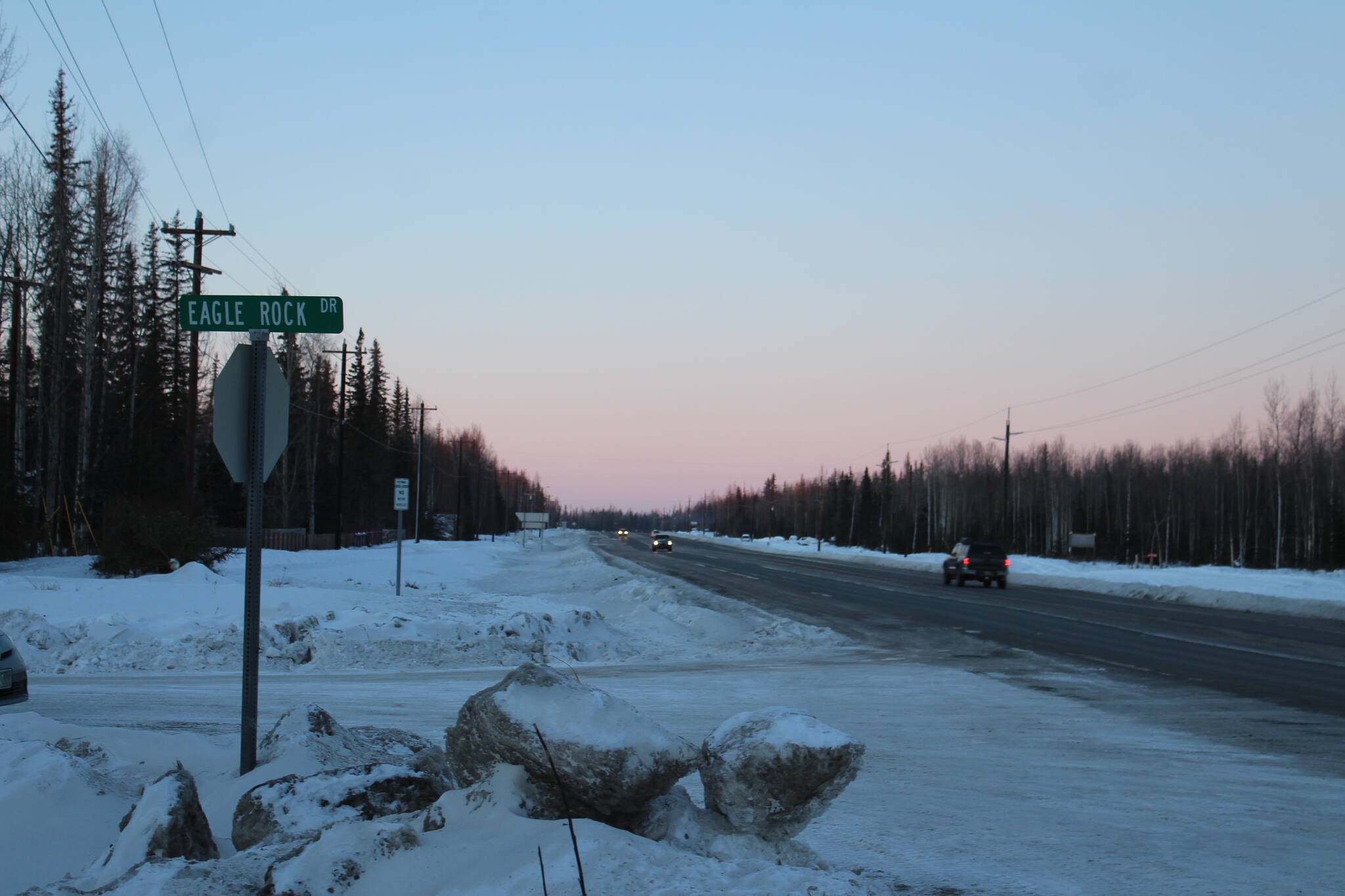 Cars drive along the Kenai Spur Highway near Eagle Rock Drive on Tuesday, Jan. 4, 2021 near Kenai, Alaska. The highway will be widened under a state transportation project. (Ashlyn O’Hara/Peninsula Clarion)