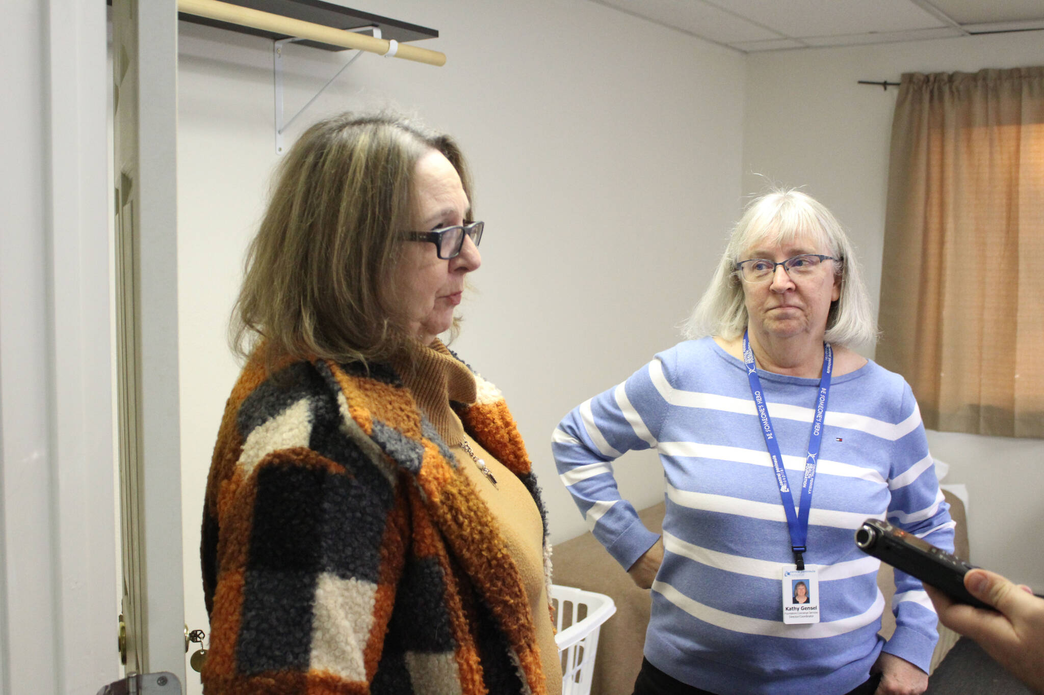 Leslie Rohr, executive director of Love INC, (left) and Kathy Gensel, president of Bridges Community Resource Network, Inc., field questions from reporters during a tour of the recently opened cold weather shelter in Nikiski, on Monday, Nov. 22, 2021, in Nikiski, Alaska.