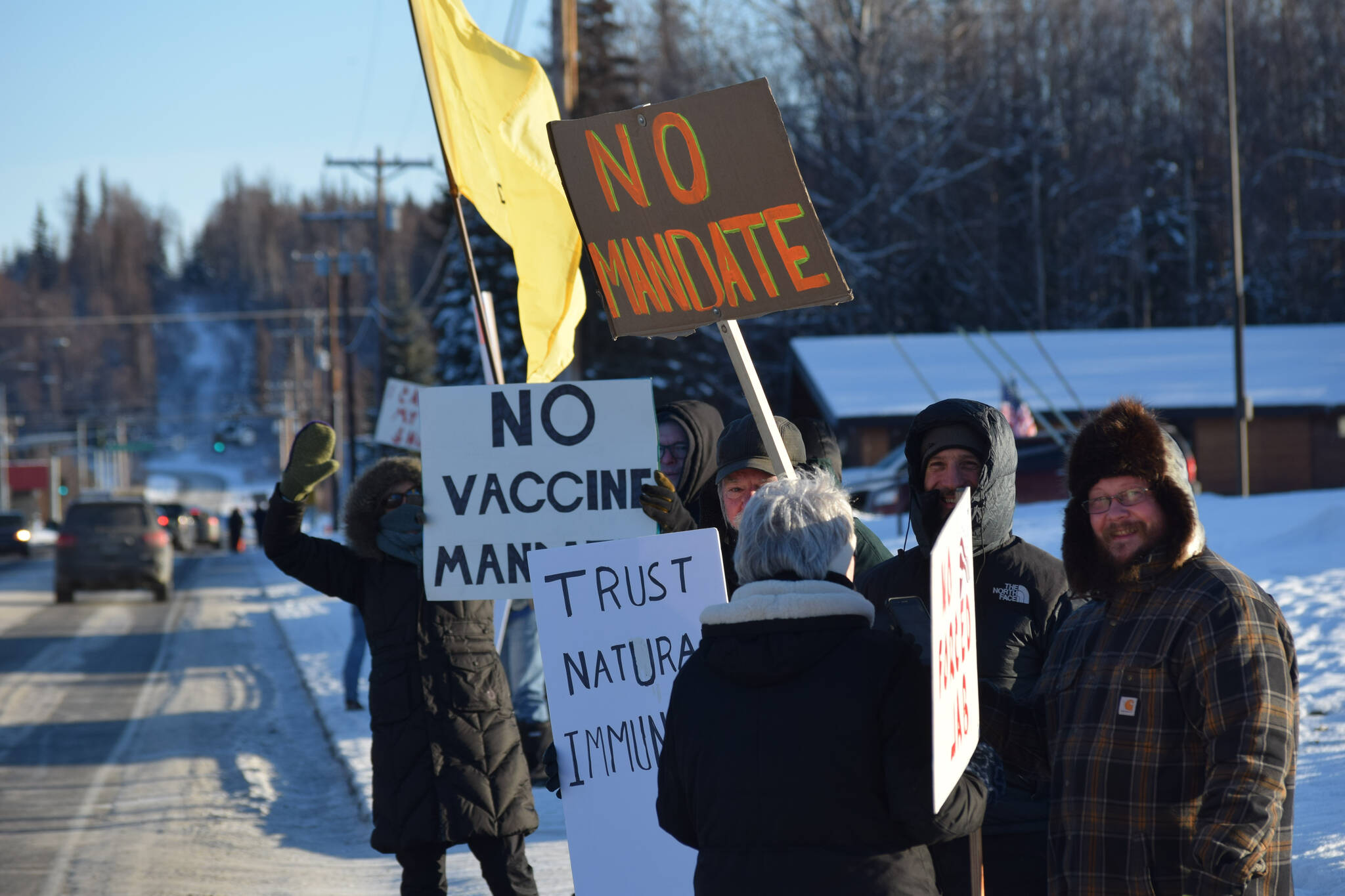 Demonstrators gather outside Central Peninsula Hospital in Soldotna to protest COVID-19 vaccine mandates and advocate for alternative treatments on Saturday, Nov. 20, 2021. (Camille Botello/Peninsula Clarion)