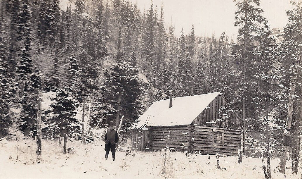 Photo courtesy of the Huttle Collection 
Robert “Bob” Huttle, posing here next to Cliff House, spent the night in this cabin in April 1934 and mused about a possible murder there.