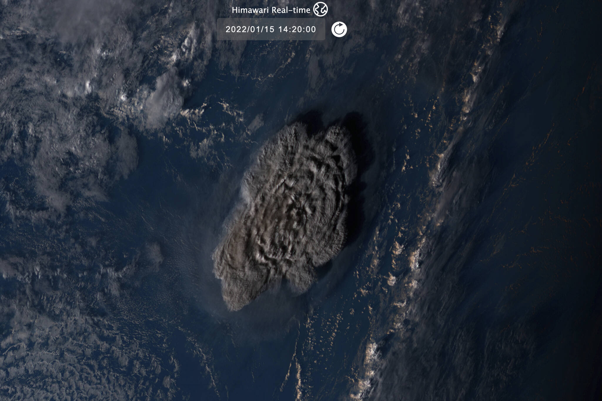 This satellite image taken by Himawari-8, a Japanese weather satellite operated by Japan Meteorological Agency and released by National Institute of Information and Communications Technology (NICT), shows an undersea volcano eruption at the Pacific nation of Tonga Saturday, Jan. 15, 2022. (NICT via AP)