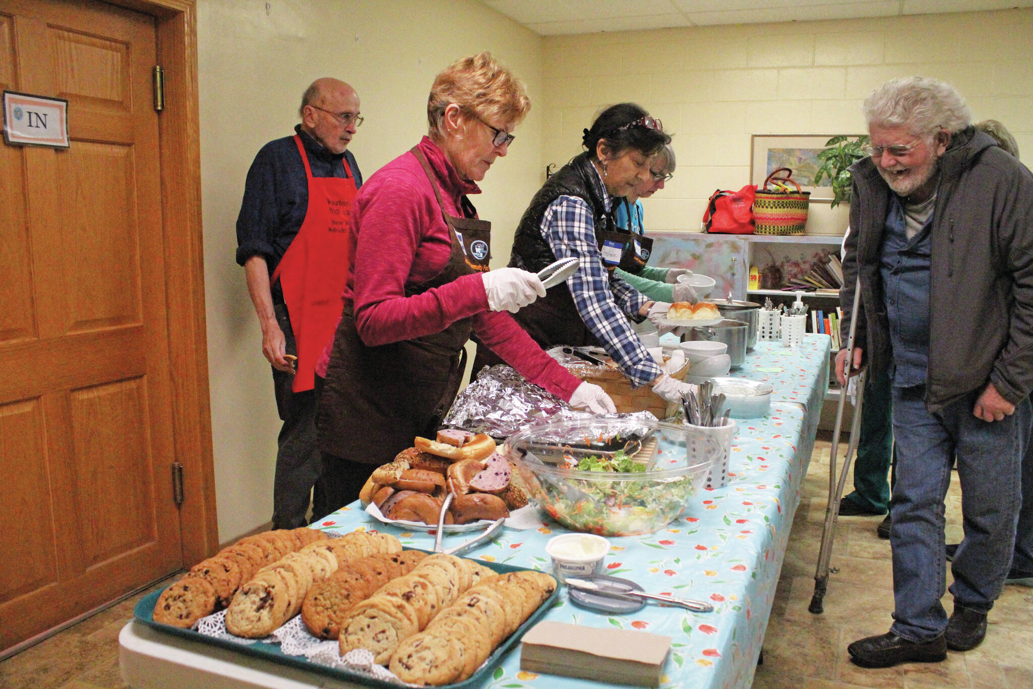 Photo by Megan Pacer/Homer News
Volunteers distibute a meal to attendees at Project Homeless Connect on Jan. 29, 2020 at Homer United Methodist Church in Homer, Alaska. The event is a one-day opportunity for the homeless to get access to necessary supplies and services.