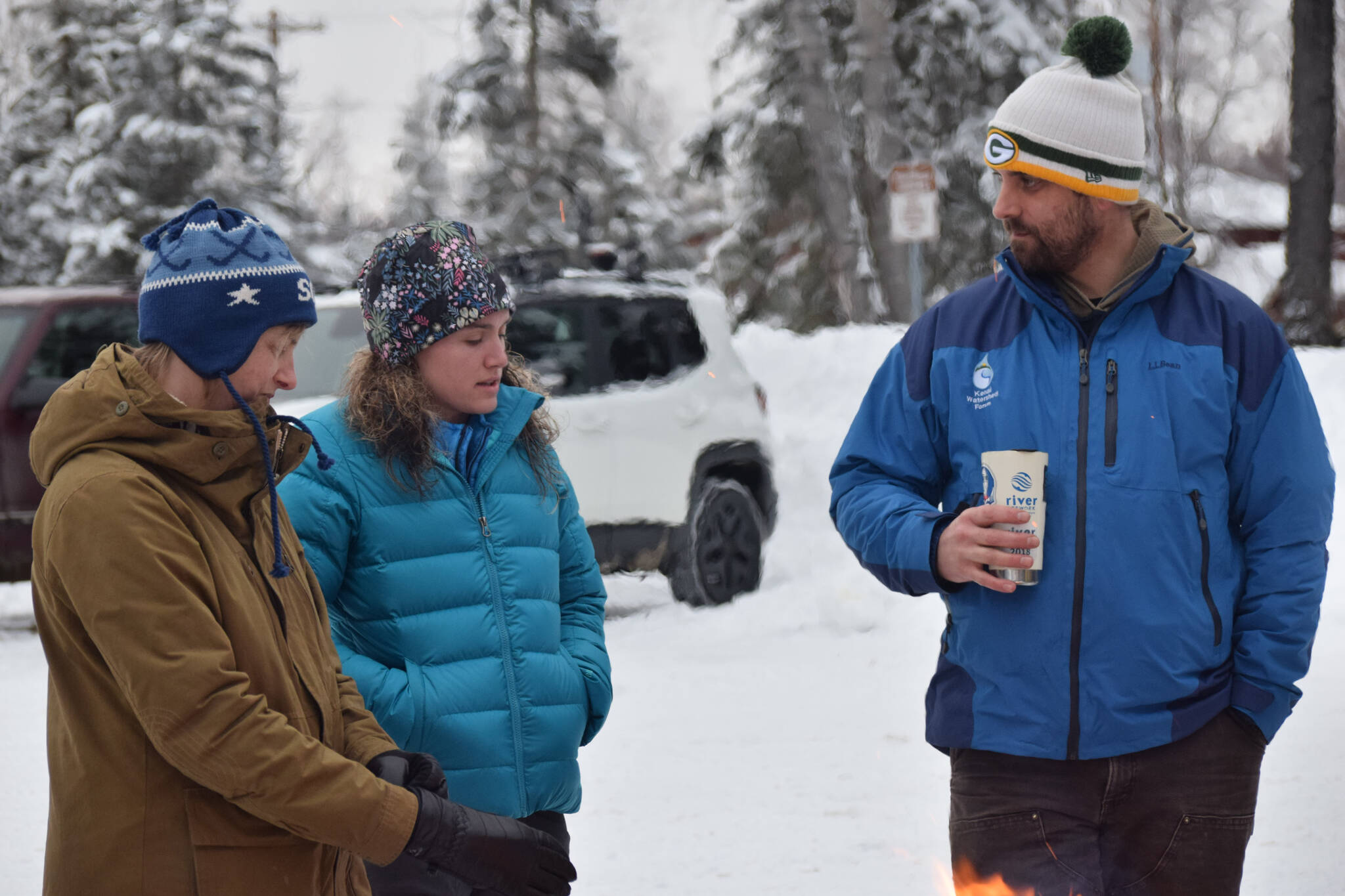 From left: Rhonda McCormick, Madison Orth and Branden Bornemann, executive director of the Kenai Watershed Forum, celebrate the 25th anniversary of the forum on Thursday, Jan. 20, 2022. (Camille Botello/Peninsula Clarion)