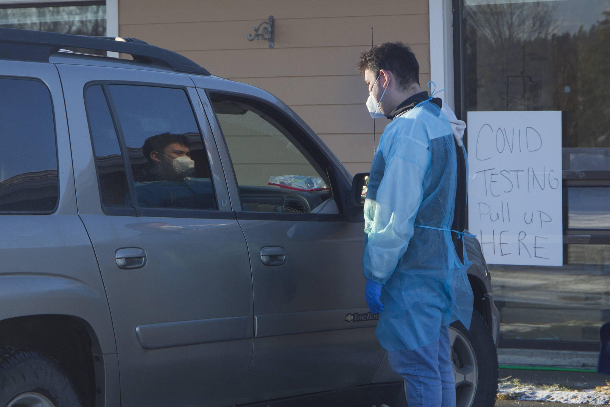 A COVID-19 test administrator discusses the testing process with a patient during the pop-up rapid testing clinic at Homer Public Health Center on Tuesday, Jan. 25, 2022. (Photo by Sarah Knapp/Homer News)