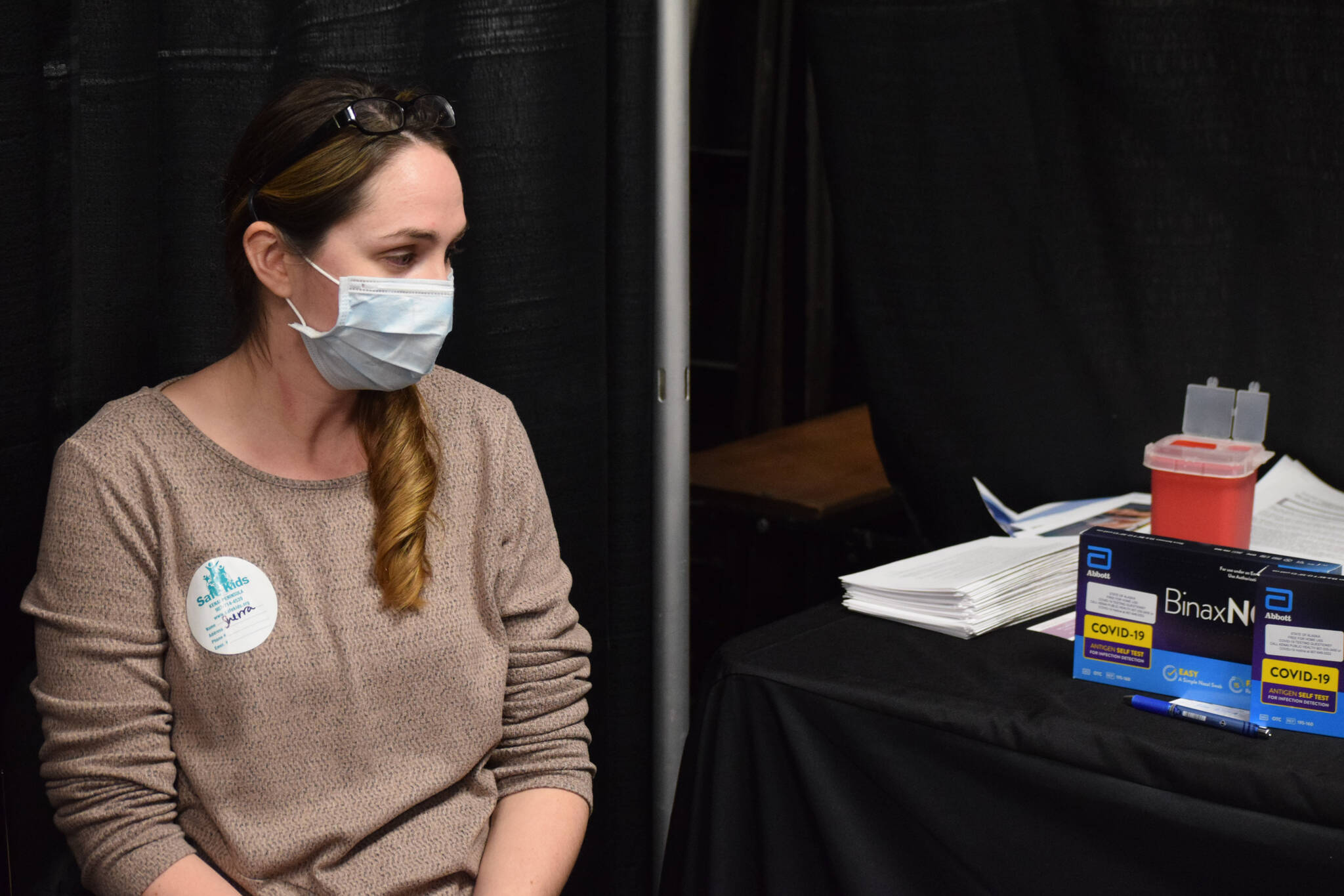 Kenai Public Health Nurse Sherra Pritchard distributes COVID-19 tests and administeres COVID and influenza vaccines during the Project Homeless Connect event at the Soldotna Regional Sports Complex in Soldotna on Wednesday, Jan. 26, 2022. (Camille Botello/Peninsula Clarion)