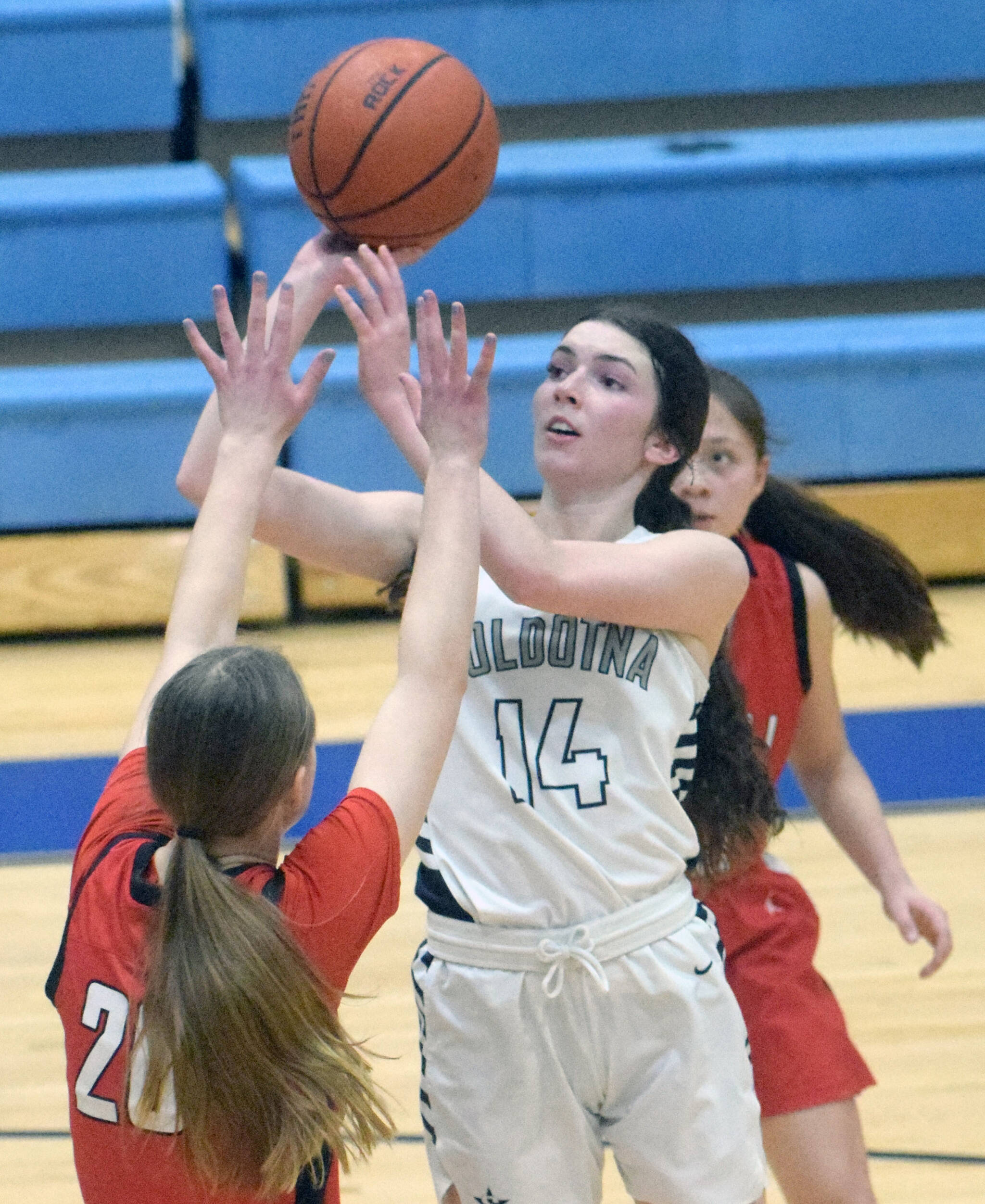 Soldotna’s Ellie Burns shoots over Kenai’s Erin Koziczkowski at Soldotna High School on Friday, Jan. 28, 2022, in Soldotna, Alaska. (Photo by Jeff Helminiak/Peninsula Clarion)