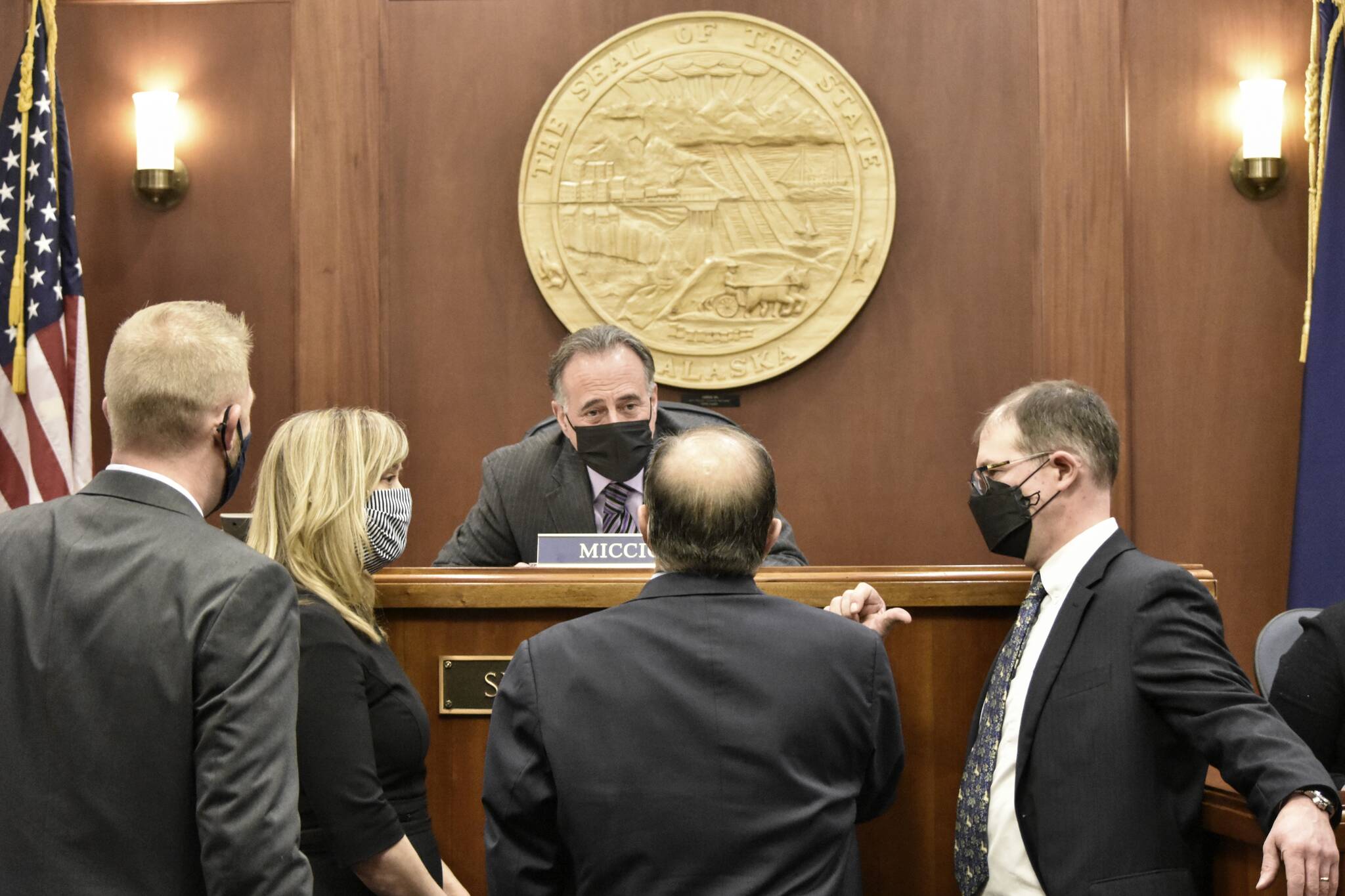 Peter Segall / Juneau Empire
Senate President Peter Micciche, R-Soldotna, seated, speaks with senators during a floor debate on a bill to revamp the state’s alcohol laws on Tuesday. The bill was one of Micciche’s own, and Tuesday’s floor vote came after nine years of trying to pass a bill modernizing Alaska’s alcohol regulation.