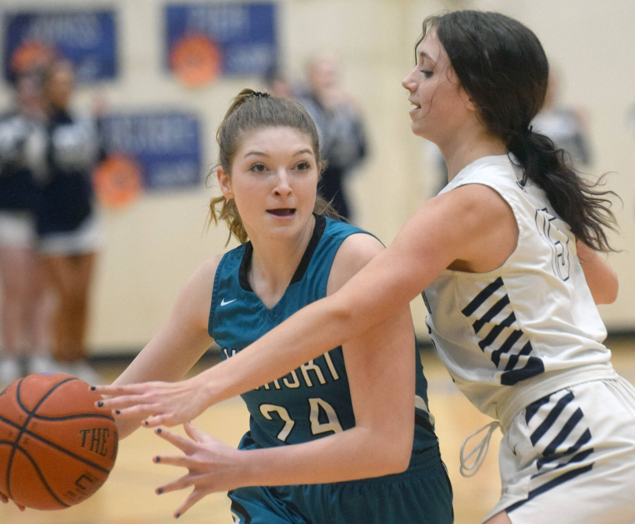 Nikiski’s Ashlynne Playle keeps the ball from Soldotna’s Adarra Hagelund on Tuesday, Feb. 8, 2022, at Soldotna High School in Soldotna, Alaska. (Photo by Camille Botello/Peninsula Clarion)