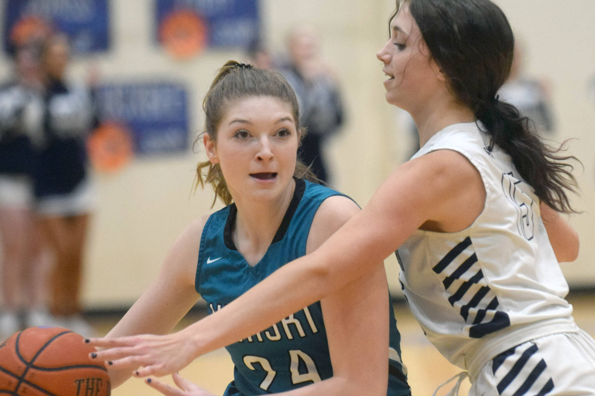 Nikiski's Ashlynne Playle keeps the ball from Soldotna's Adarra Hagelund on Tuesday, Feb. 8, 2022, at Soldotna High School in Soldotna, Alaska. (Photo by Camille Botello/Peninsula Clarion)