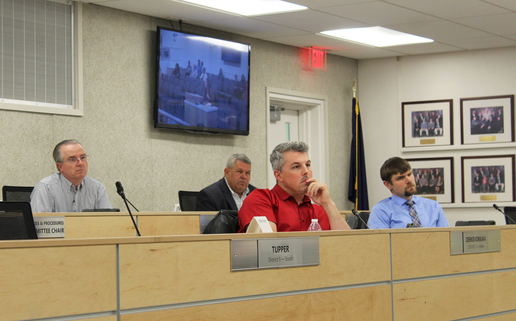 Aaron Rhoades, Charlie Pierce, Richard Derkevorkian and Jesse Bjorkman listen to testimony during a meeting of the Kenai Peninsula Borough Assembly on Tuesday, Dec. 7, 2021 in Kenai, Alaska. (Ashlyn O’Hara/Peninsula Clarion)