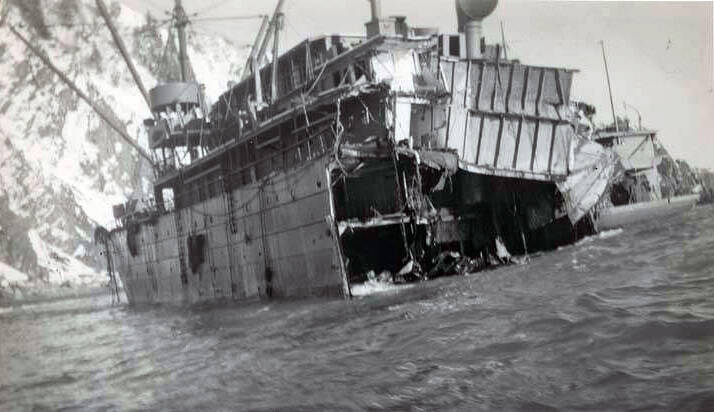 Photos from Seward Community Library Association collection in Alaska Digital Archives
S.S. Yukon is perched half left on the rocks after the steamship broke in half, the stern sank out of sight. This forward section remained wedged on the rocks off Cape Fairfield, near the entrance of Prince William Sound.