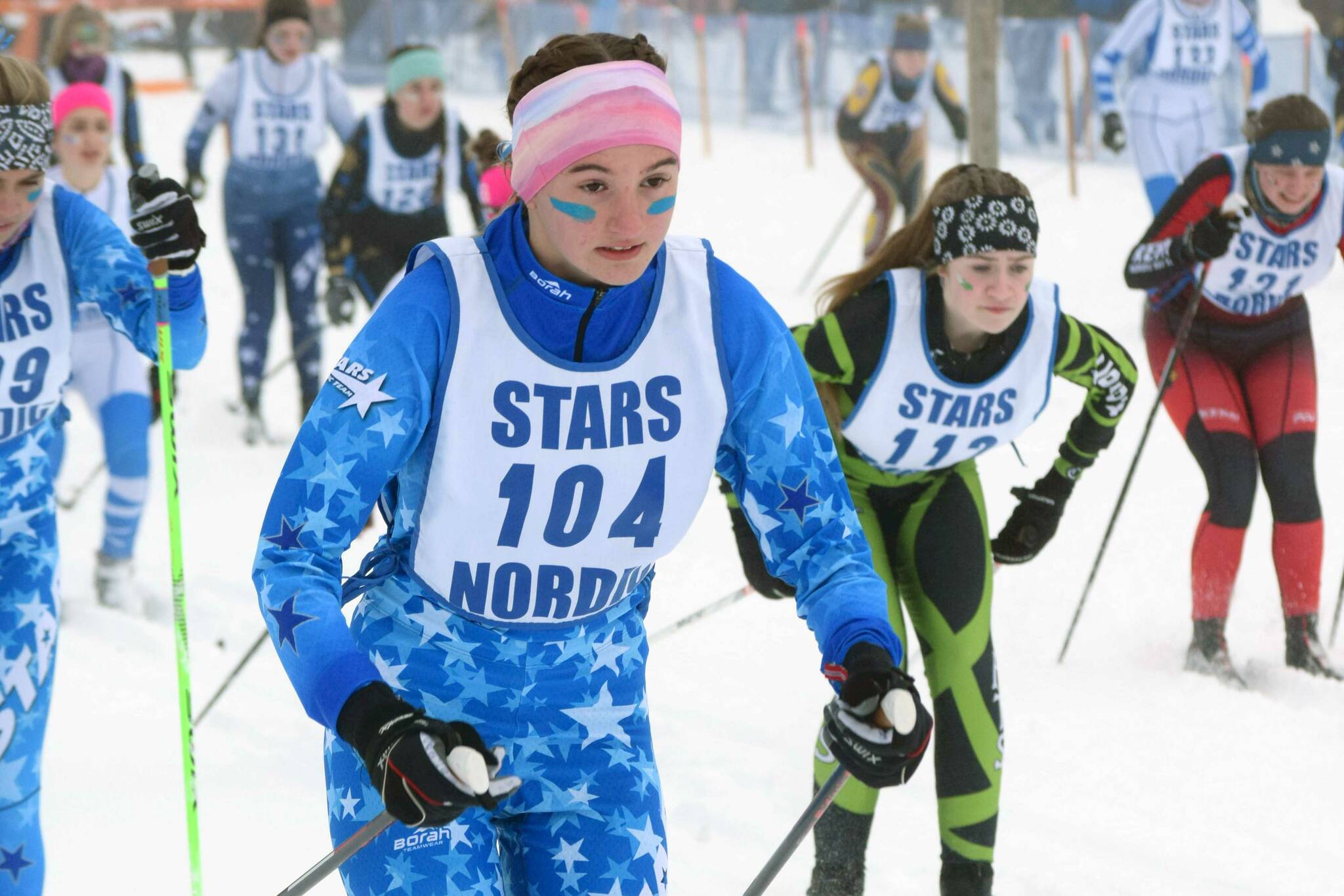 Soldotna's Jordan Ruffner starts the girls 5-kilometer classic mass start race Saturday, Feb. 12, 2022, at the Region III ski championships at Tsalteshi Trails just outside of Soldotna, Alaska. (Photo by Camille Botello/Peninsula Clarion)