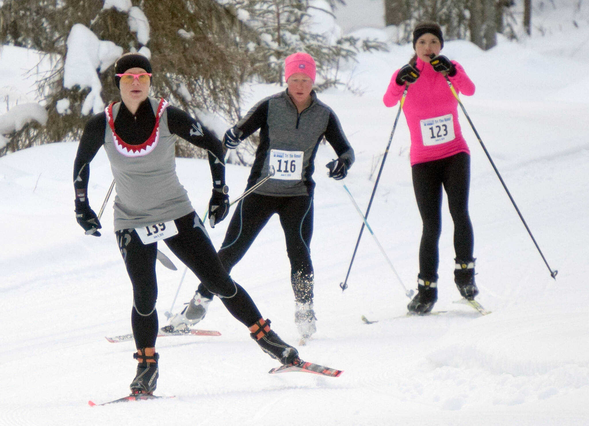 Morgan Aldridge, Melissa Smith and Libby Jensen lead the Ski for Women on Sunday, Feb. 13, 2022, at Tsalteshi Trails just outside of Soldotna, Alaska. (Photo by Jeff Helminiak/Peninsula Clarion)