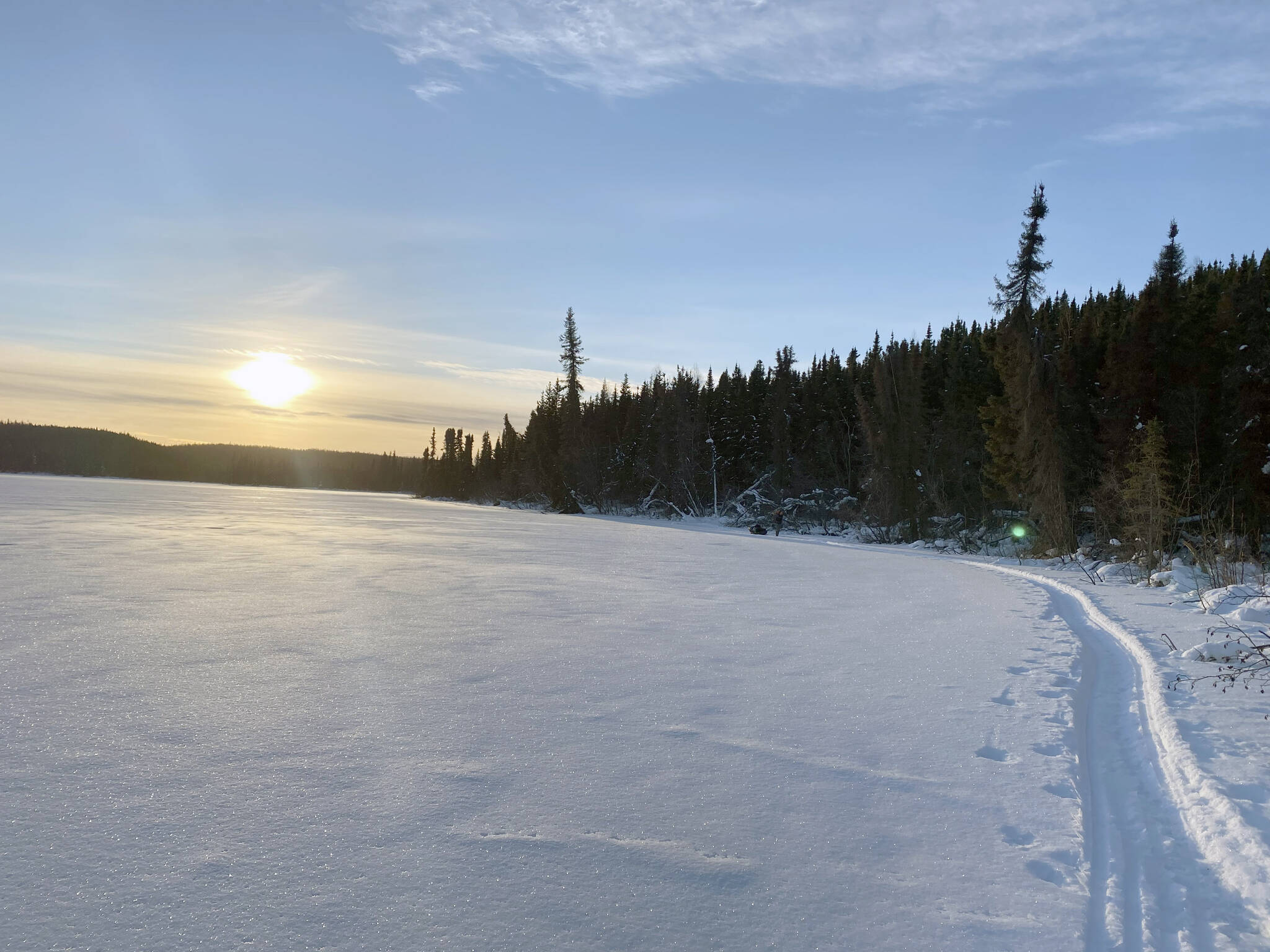 Hiking into the refuge by using frozen lakes as access. (Photo by Nate Perrine)