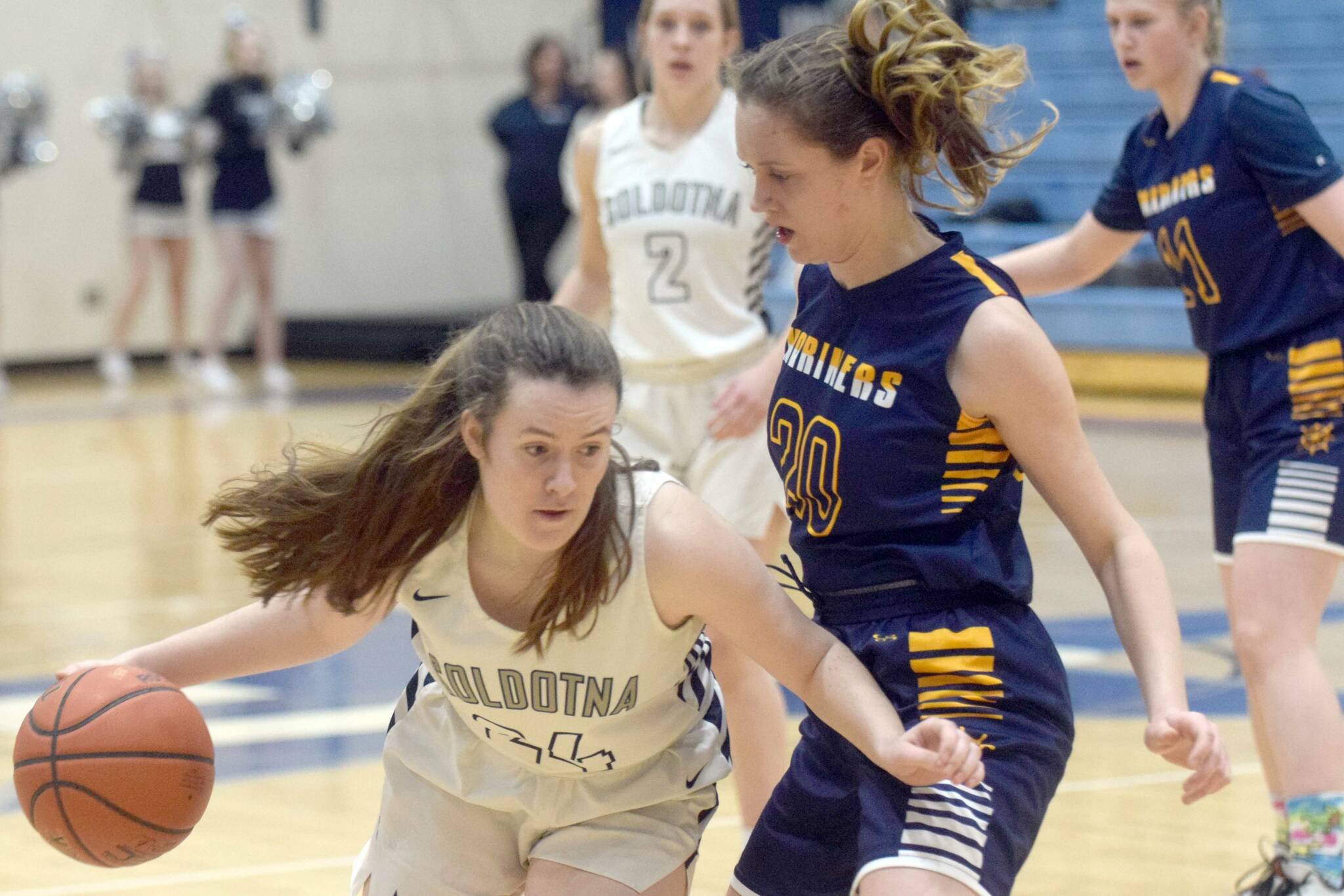 Soldotna's Tanner Inman looks to drive on Homer's Mel Morris on Thursday, Feb. 17, 2022, at Soldotna High School in Soldotna, Alaska. (Photo by Camille Botello/Peninsula Clarion)