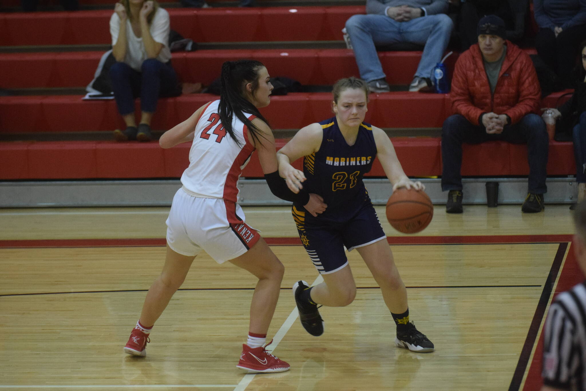Kenai’s Amber Nash defends Homer’s Sophie Ellison during the conference game in Kenai on Saturday, Feb. 19, 2022. (Camille Botello/Peninsula Clarion)