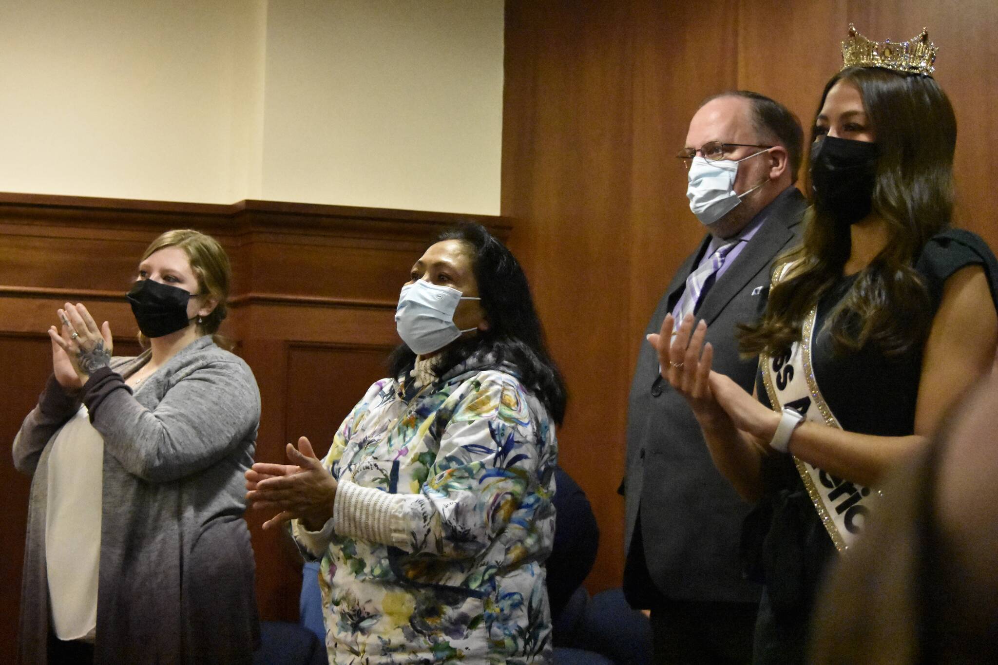 From left: Carley Rose Kelley; First Lady of Alaska Rose Dunleavy; Department of Corrections officer Sergeant Ken Noland and Alaska’s first Miss America pageant winner Emma Boyles, applaud Gov. Mike Dunleavy’s State of the State address on Tuesday, Jan. 25, 2022. (Peter Segall / Juneau Empire)