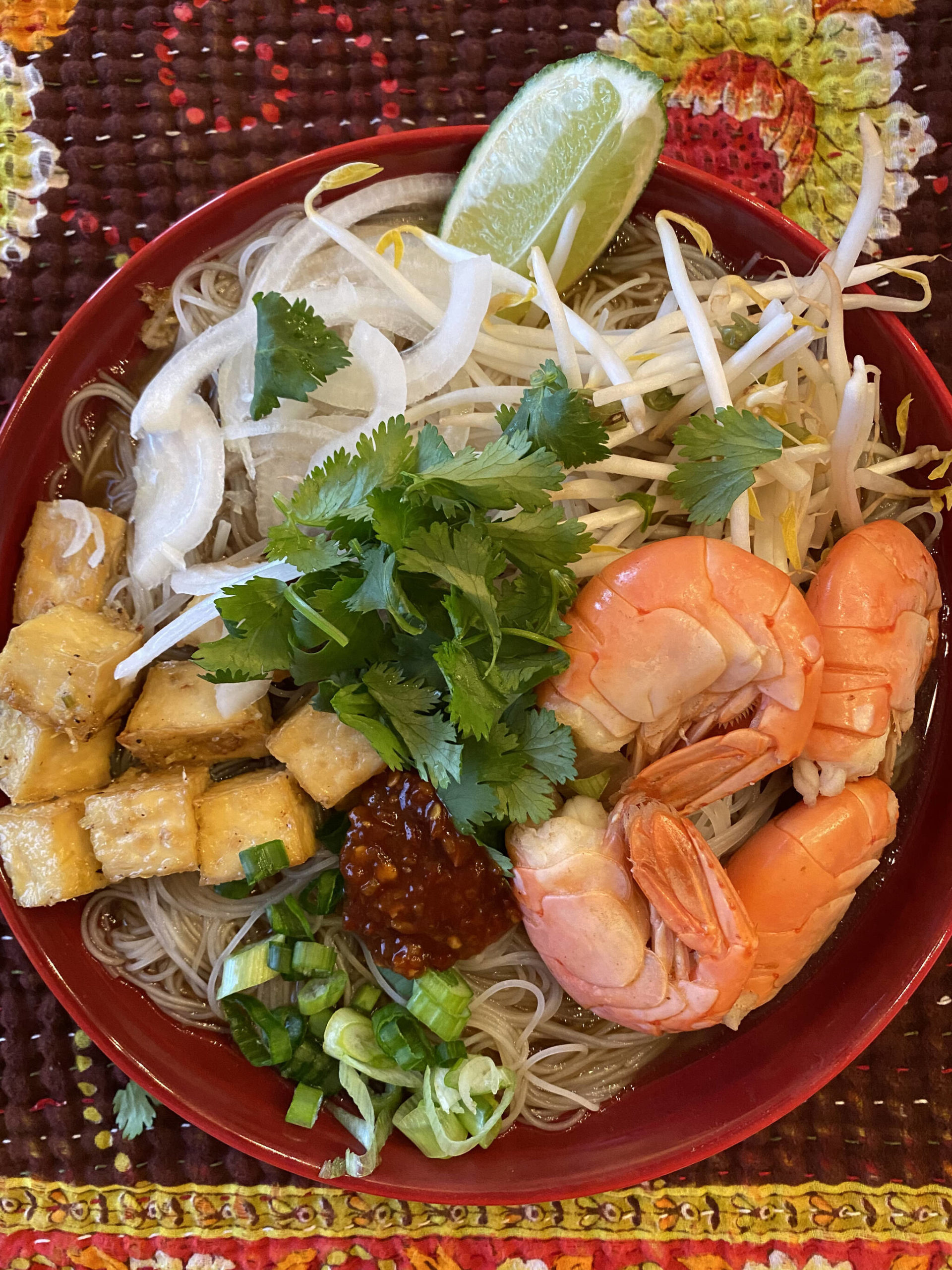 Rice noodles, tofu, lemon grass, cilantro, shrimp and bean sprouts top this homemade pho. (Photo by Tressa Dale/Peninsula Clarion)