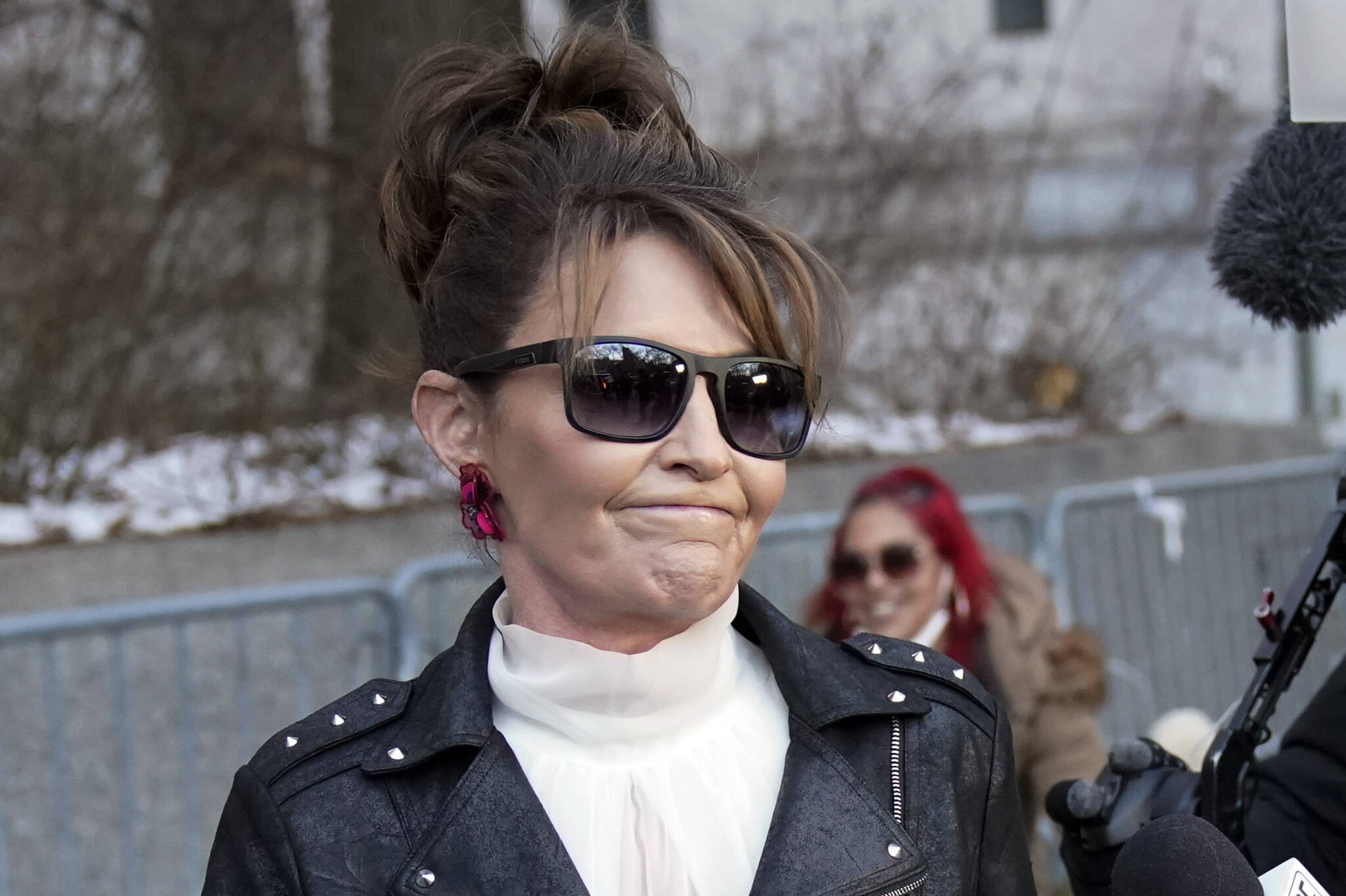 Former Alaska Gov. Sarah Palin reacts as she leaves a courthouse in New York, Monday, Feb. 14, 2022. Palin lost her libel lawsuit against The New York Times on Tuesday, Feb. 15, 2022, when a jury rejected her claim that the newspaper maliciously damaged her reputation by erroneously linking her campaign rhetoric to a mass shooting. (AP Photo/Seth Wenig, File)