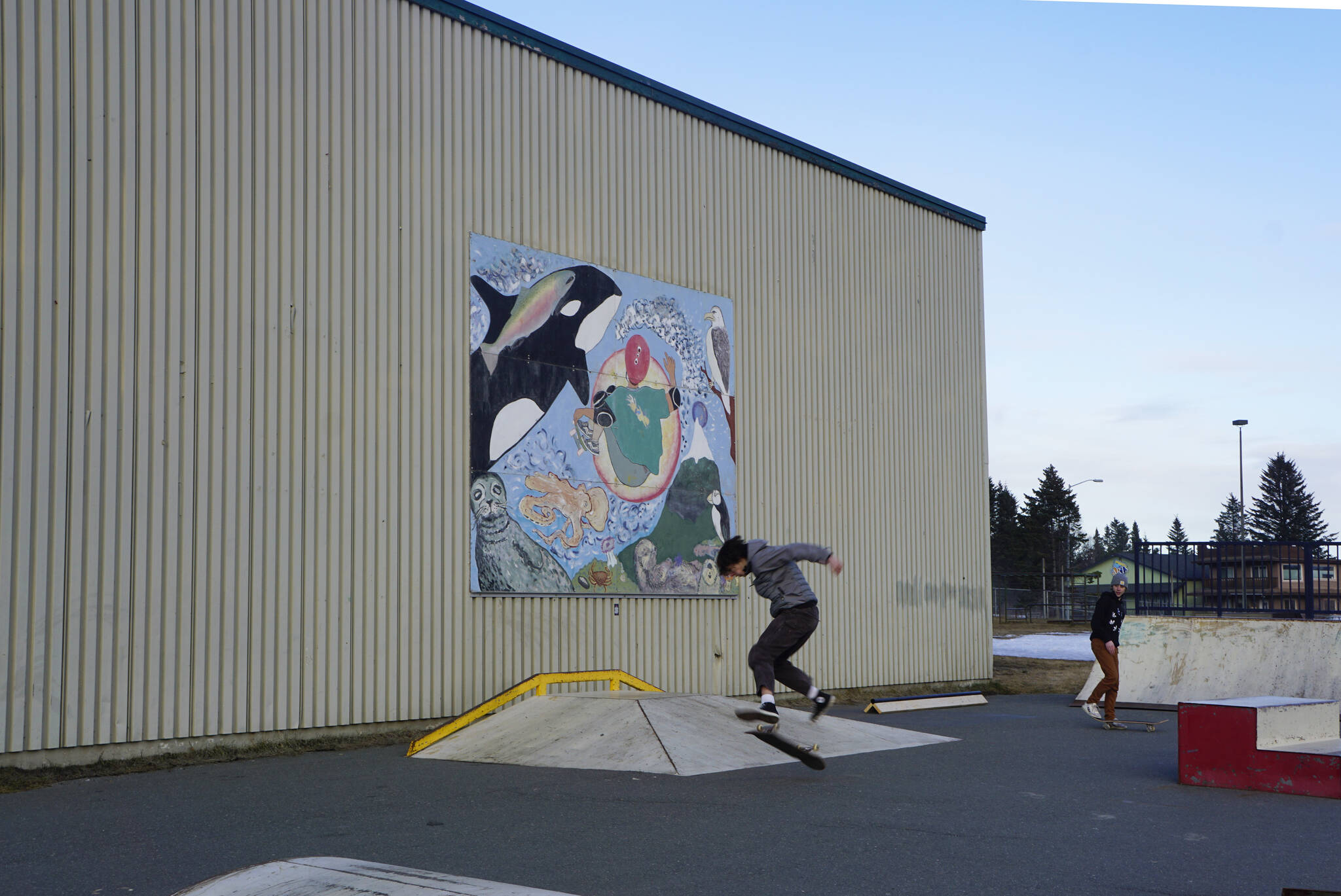 A group of young people try out the thawed skate park on Monday, Feb. 28, 2022, at the Homer Education and Recreation Complex in Homer, Alaska. The Homer City Council met Monday and heard a report by Stantec staff on a proposed design for a new community center to go on the HERC site. The design includes a skate park. (Photo by Michael Armstrong/Homer News)