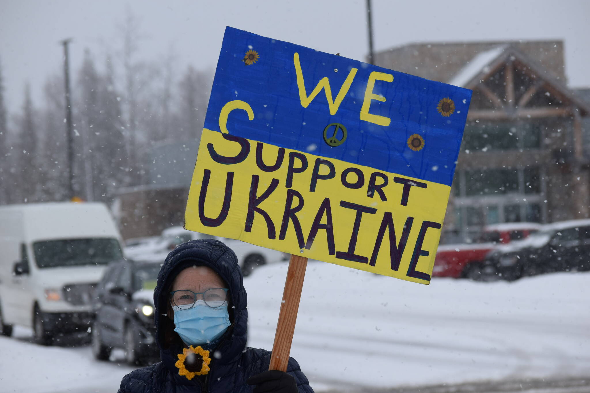 Michele Vasquez demonstrates during the Many Voices Ukraine vigil on Saturday, March 5, 2022, in Soldotna, Alaska. (Camille Botello/Peninsula Clarion)