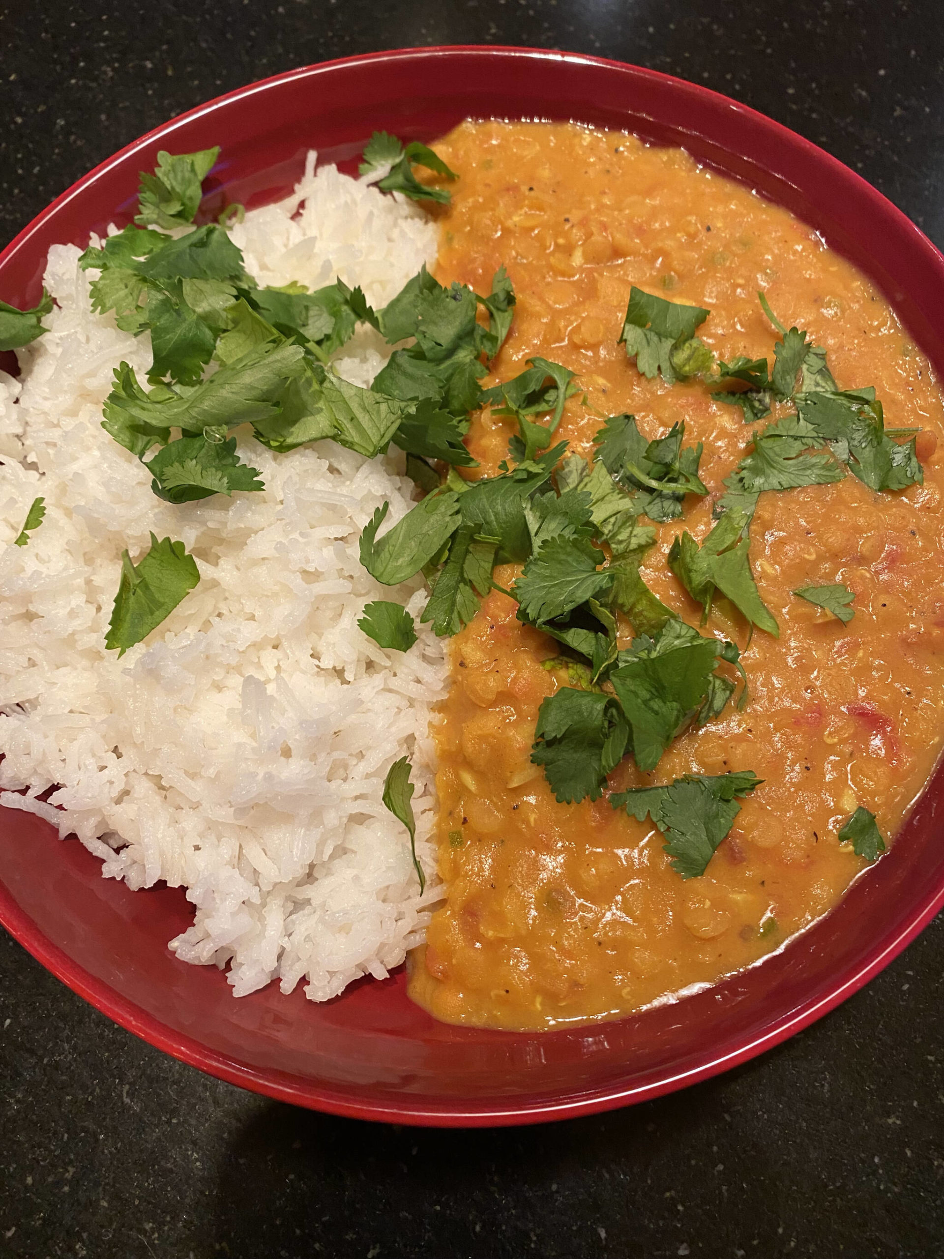 Curried lentils are served with basmati rice and garnished with cilantro. (Photo by Tressa Dale/Peninsula Clarion)