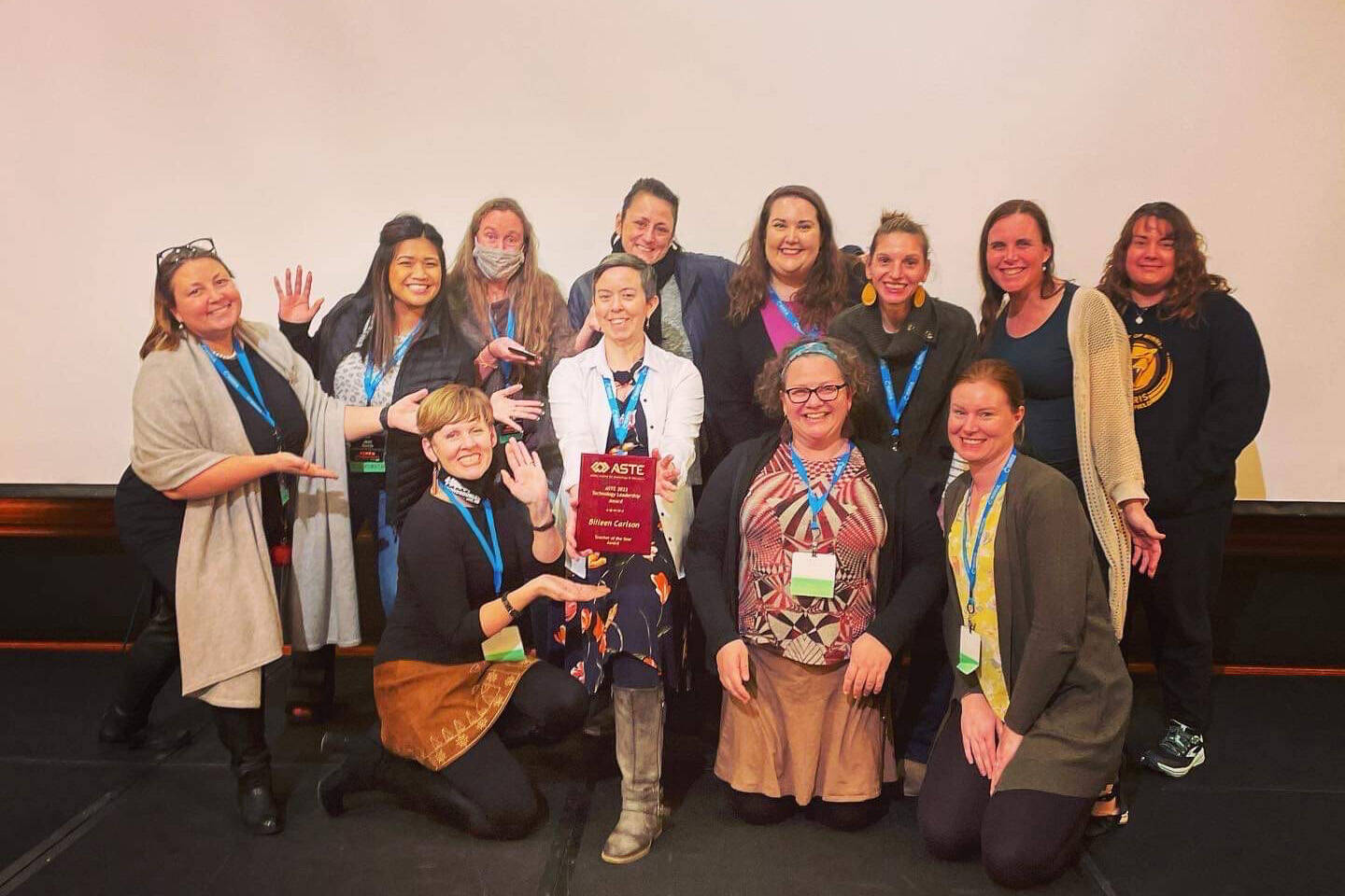 Nikolaevsk School teacher Billeen Carlson, center, shows her Alaska Society for Technology in Education Teacher of the Year award. (Photo provided)