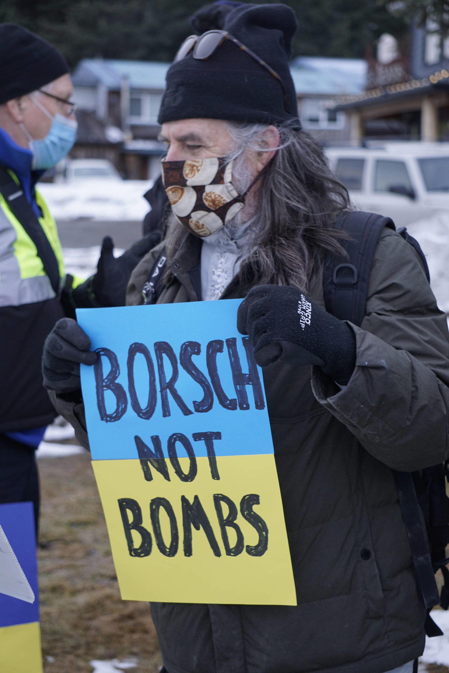 Wes Schatz holds a sign in support of Ukraine at a demonstration on Thursday, March 3, 2022, at WKFL Park in Homer, Alaska. (Photo by Michael Armstrong/Homer News)