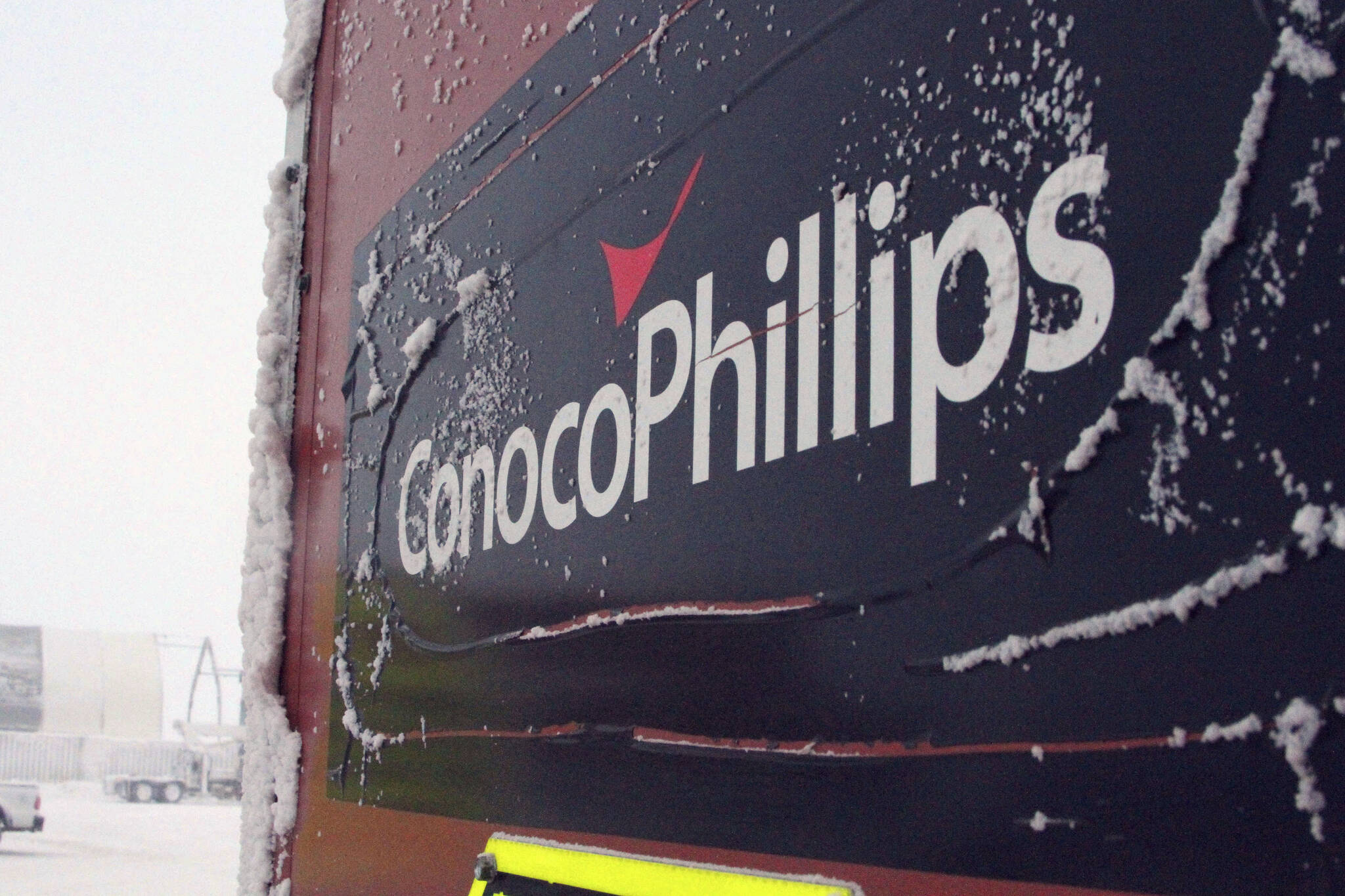 This Feb. 9, 2016, file photo shows an ice-covered ConocoPhillips sign at a drilling site in Nuiqsut, Alaska. Authorities are investigating a natural gas leak detected last week at a ConocoPhillips Alaska oil drill site on Alaska’s North Slope, officials said. Grace Salazar, a special assistant with the Alaska Oil and Gas Conservation Commission, said Wednesday, March 9, 2022, that the commission that oversees oil and gas drilling in the state is investigating the matter. (AP Photo/Mark Thiessen, File)