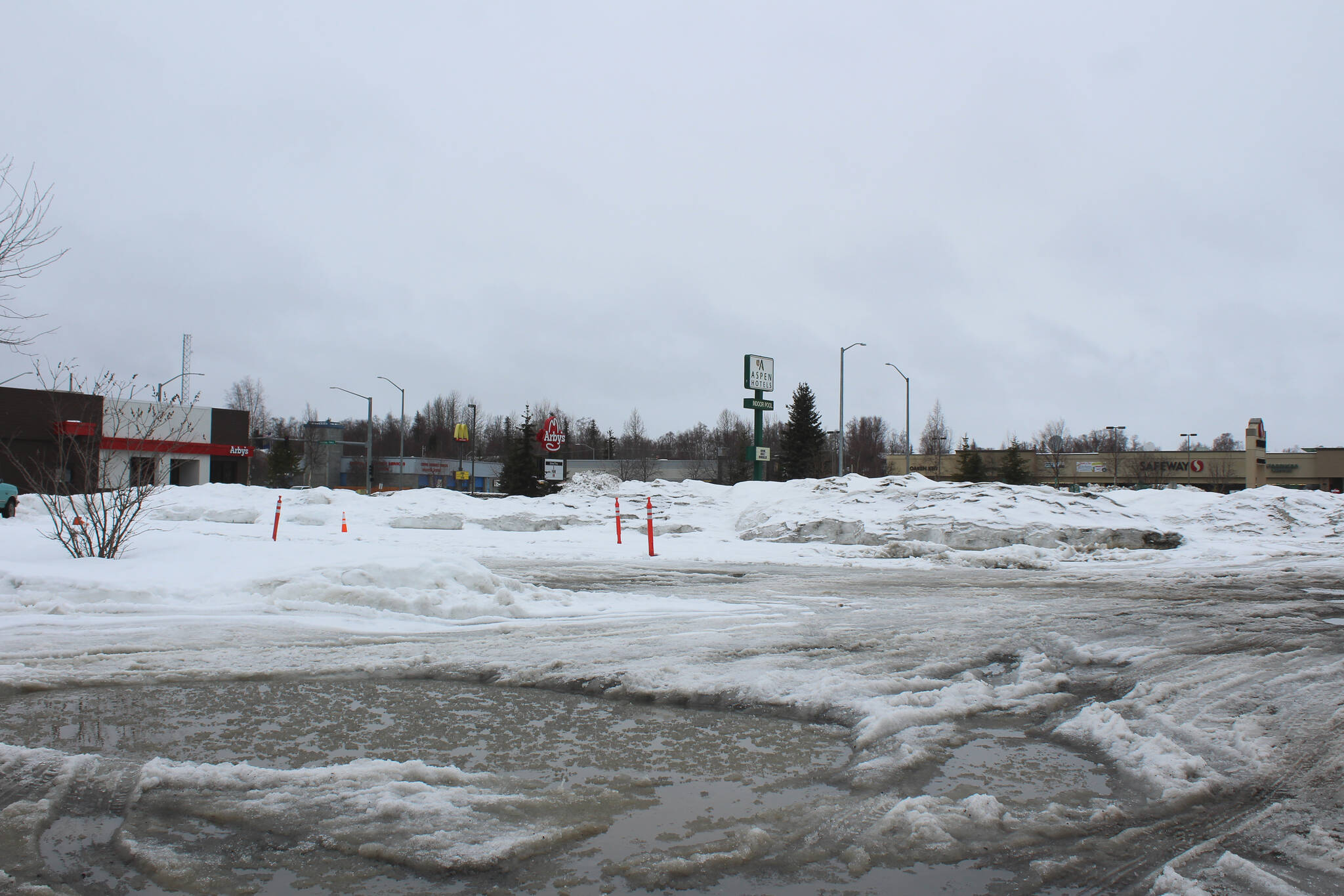 Snow collects in a lot near the Aspen Hotel on Thursday, March 10, 2022 in Soldotna, Alaska. The area will be the site of a new parking lot planned by the City of Soldotna. (Ashlyn O’Hara/Peninsula Clarion)