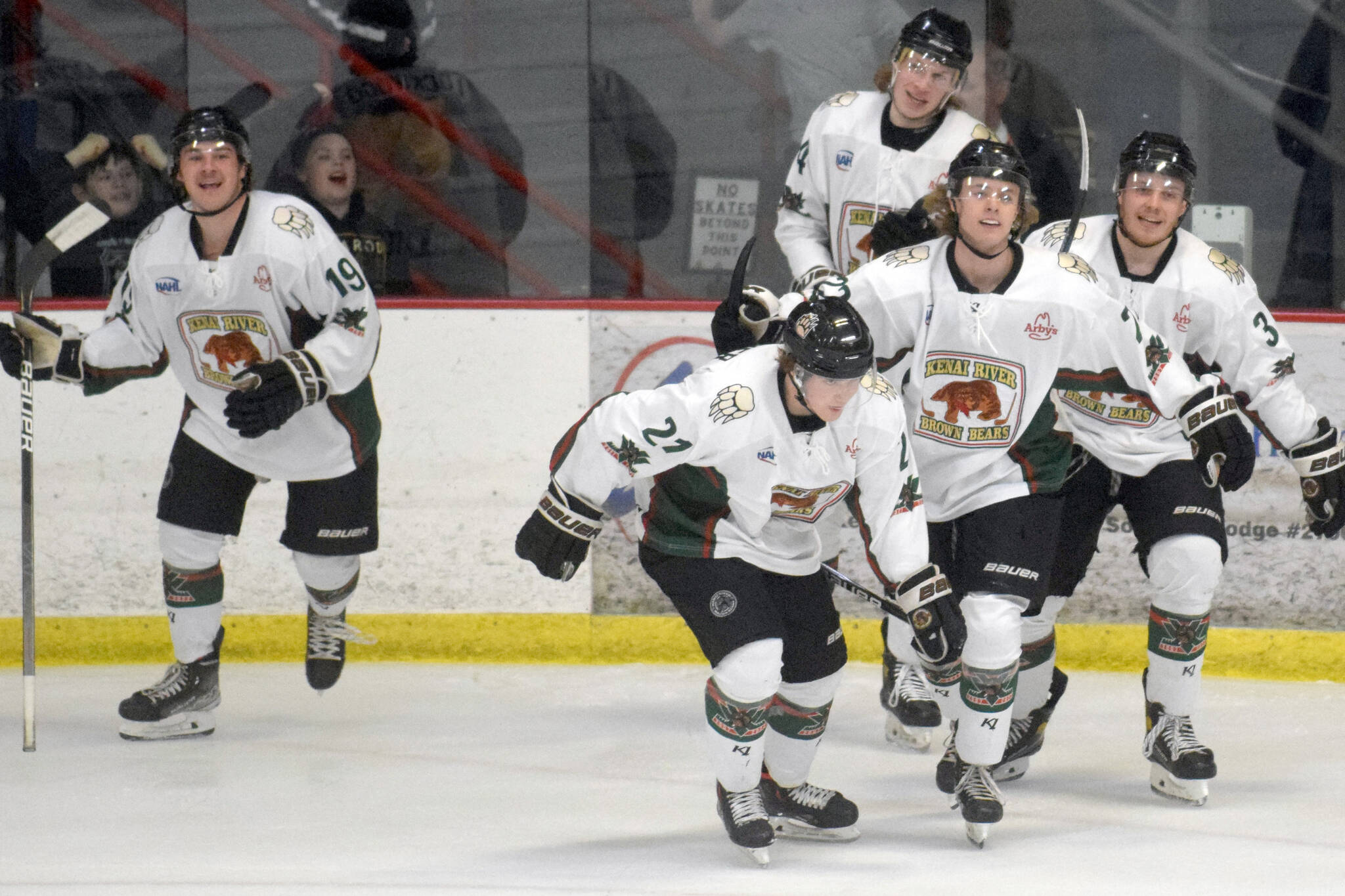 The Kenai River Brown Bears celebrate a goal by Carter Cloutier (21) against the Fairbanks Ice Dogs on Friday, March 11, 2022, at the Soldotna Regional Sports Complex in Soldotna, Alaska. (Photo by Jeff Helminiak/Peninsula Clarion)