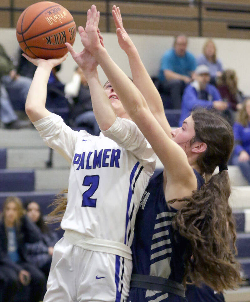 Soldotnas Ellie Burns reaches for a block on Palmers Paige Marshall during a loss to Palmer in the first round of the Northern Lights Conference tournament Thursday, March 17, 2022, at Palmer High School in Palmer, Alaska. (Photo by Ron Jones/matsusports.net)