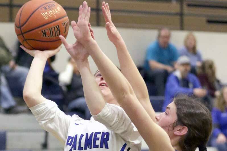 Soldotna’s Ellie Burns reaches for a block on Palmer's Paige Marshall during a loss to Palmer in the first round of the Northern Lights Conference tournament Thursday, March 17, 2022, at Palmer High School in Palmer, Alaska. (Photo by Ron Jones/matsusports.net)