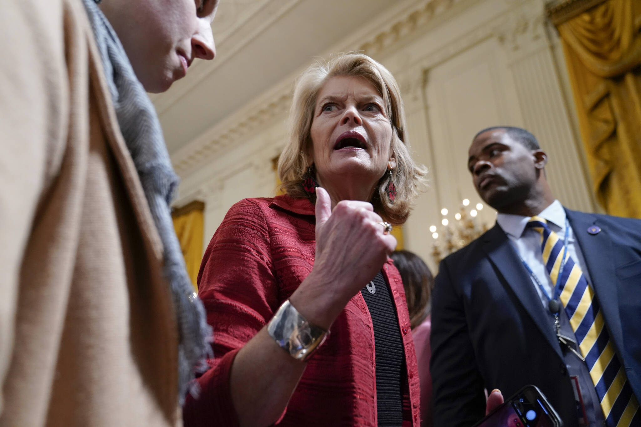 Sen. Lisa Murkowski, R-Alaska, talks with a reporter after attending at an event to celebrate the reauthorization of the Violence Against Women Act in the East Room of the White House, Wednesday, March 16, 2022, in Washington. Murkowski spoke the the Alaska House of Representatives Special Committee on Tribal Affairs Thursday about what the bill means for Alaska. (AP Photo/Patrick Semansky)