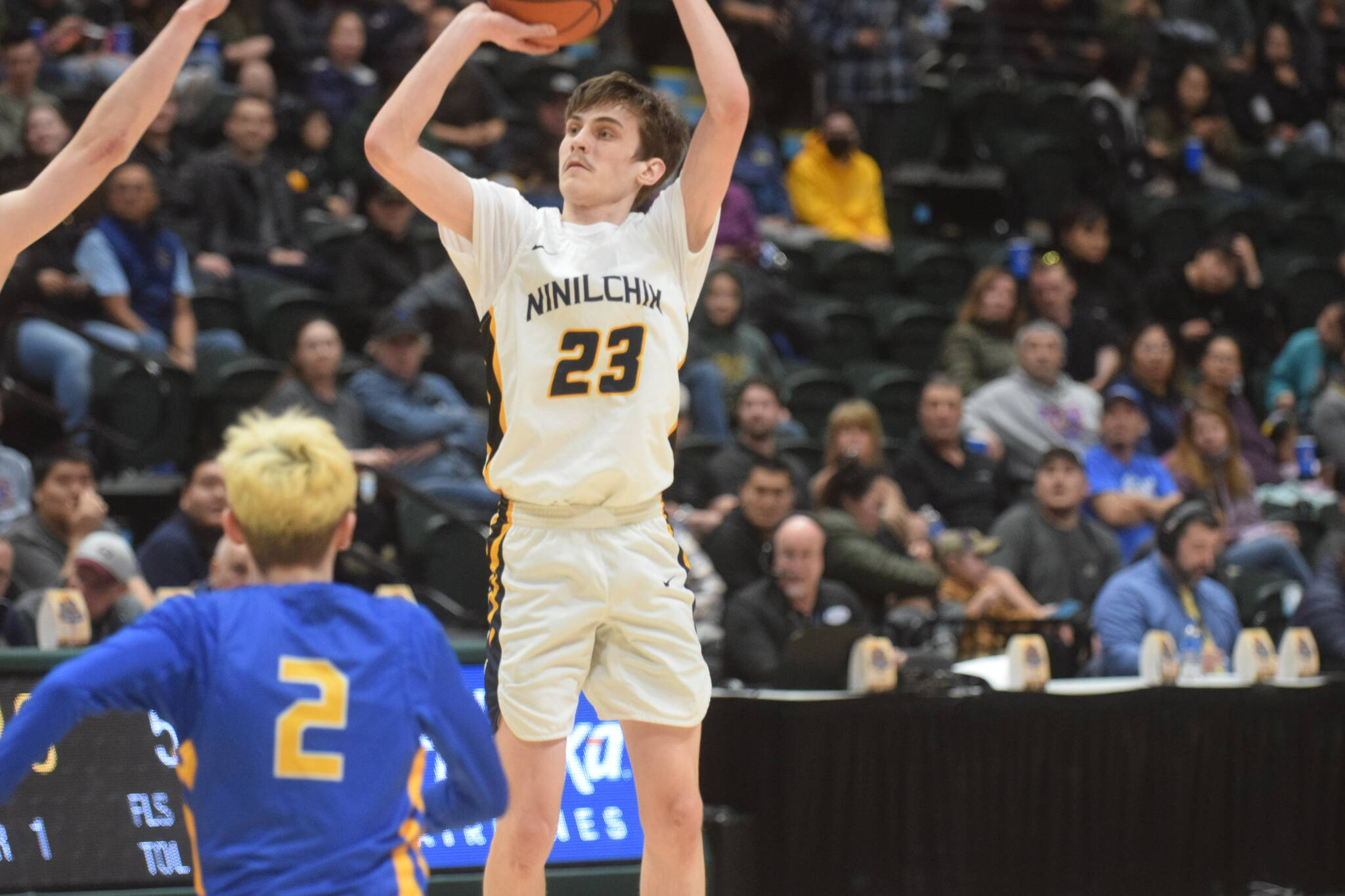 Iukah Kalugin takes a shot against Metlakatla during the 2A state basketball championship game at the Alaska Airlines Center in Anchorage, Alaska on Saturday, March 19, 2022. (Camille Botello/Peninsula Clarion)