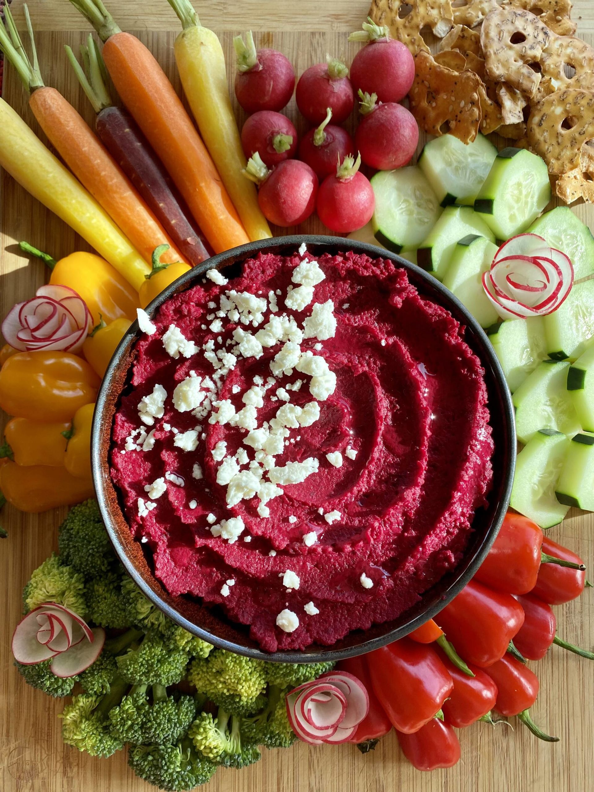 Garbanzo beans and beets are topped with feta to provide a colorful dip for springtime crudité. (Photo by Tressa Dale/Peninsula Clarion)