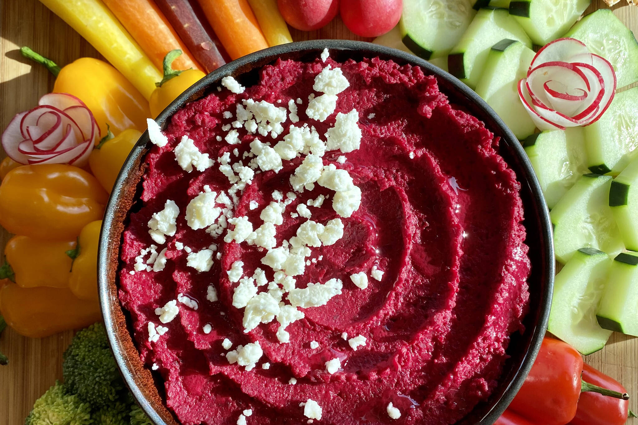 Garbanzo beans and beets are topped with feta to provide a colorful dip for springtime crudité. (Photo by Tressa Dale/Peninsula Clarion)