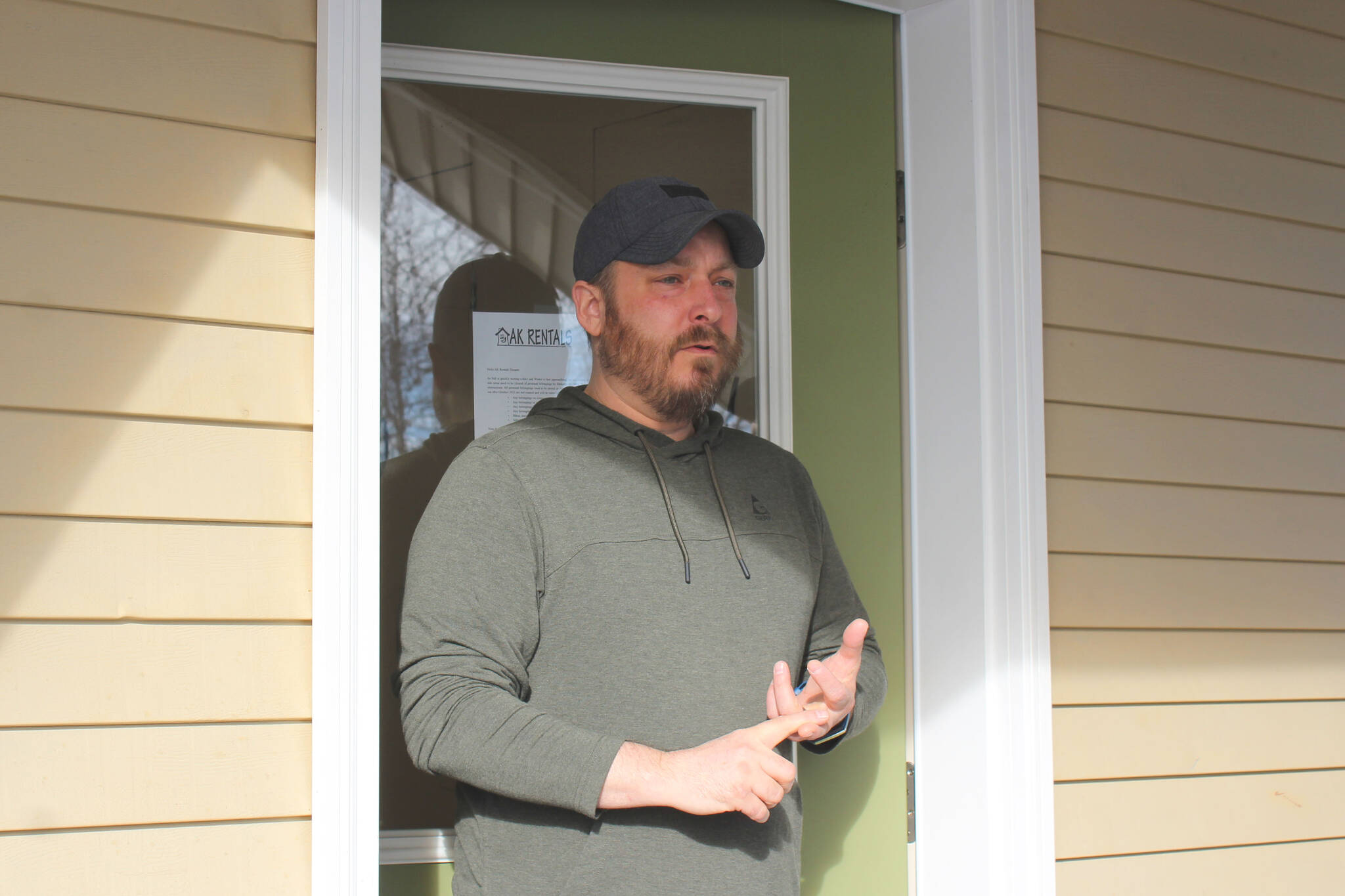 Tyson Cox speaks to potential tenants at one of his apartment buildings on Tuesday, March 22, 2022, in Soldotna, Alaska. (Ashlyn O’Hara/Peninsula Clarion)