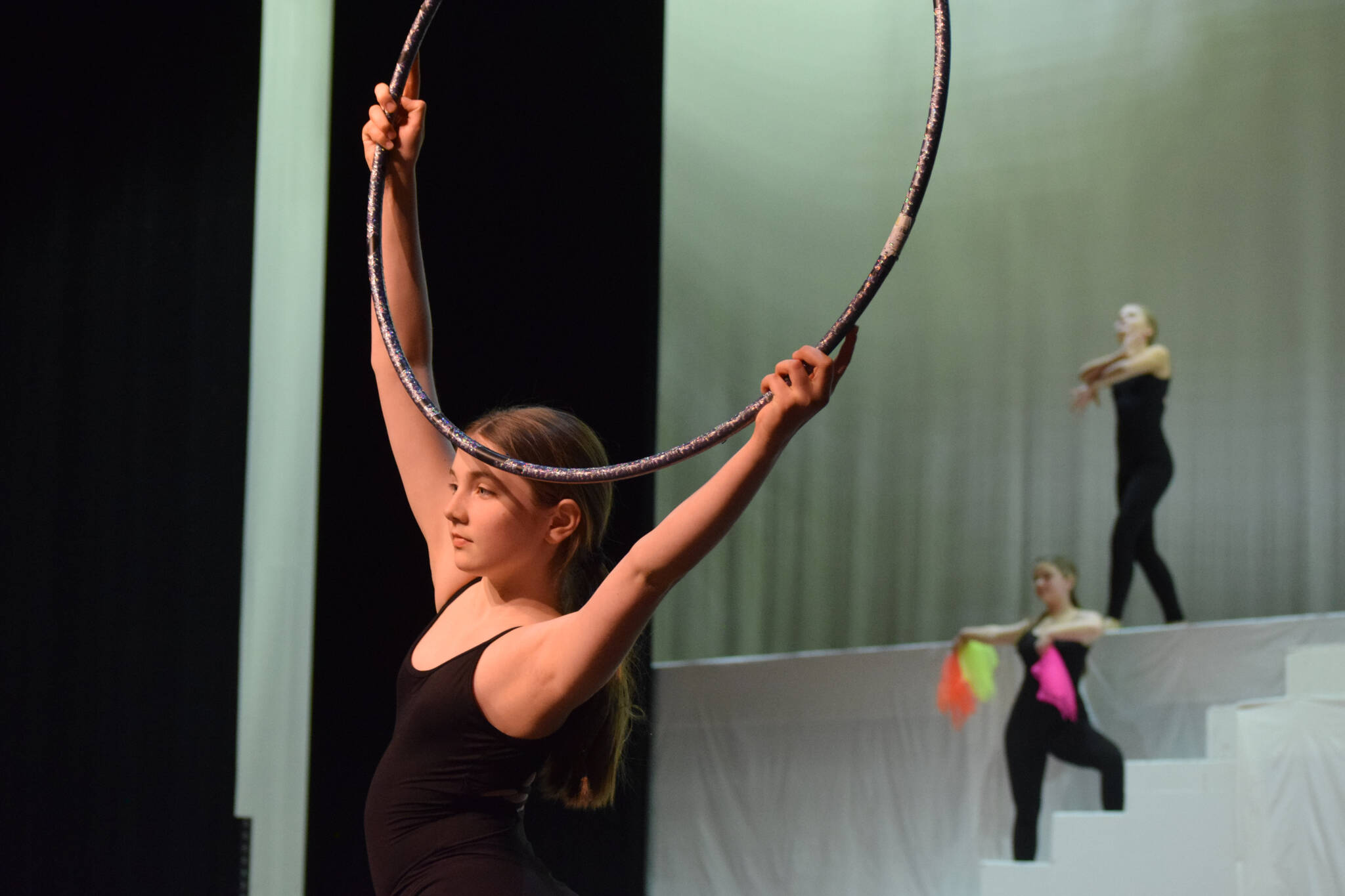 Performers prepare for the Forever Dance company showcase “Among Dreams” during a rehearsal on Tuesday, March 22, 2022, at the Renee C. Henderson Auditorium in Kenai, Alaska. (Camille Botello/Peninsula Clarion)