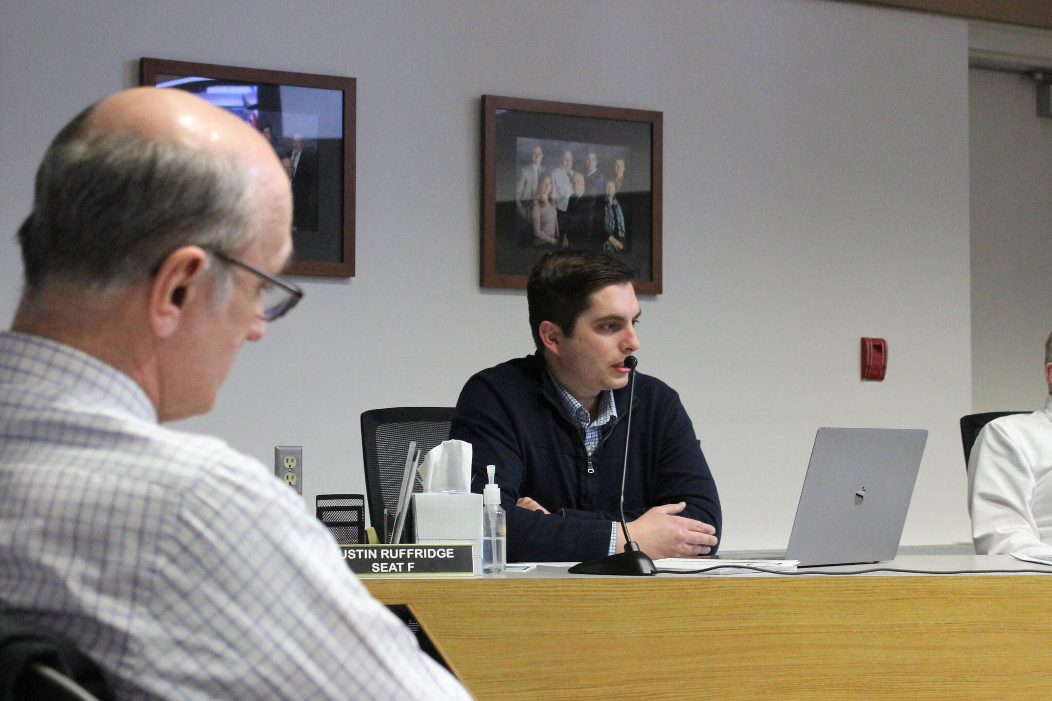 Soldotna City Council member Justin Ruffridge speaks at the city council meeting on Wednesday, March 23, 2022, in Soldotna, Alaska. Ruffridge, who also owns Soldotna Professional Pharmacy and has helped spearhead multiple COVID-19 response efforts on the central Kenai Peninsula, said it was important to acknowledge the repeal of mask recommendations for “celebration’s sake.” (Ashlyn O’Hara/Peninsula Clarion)