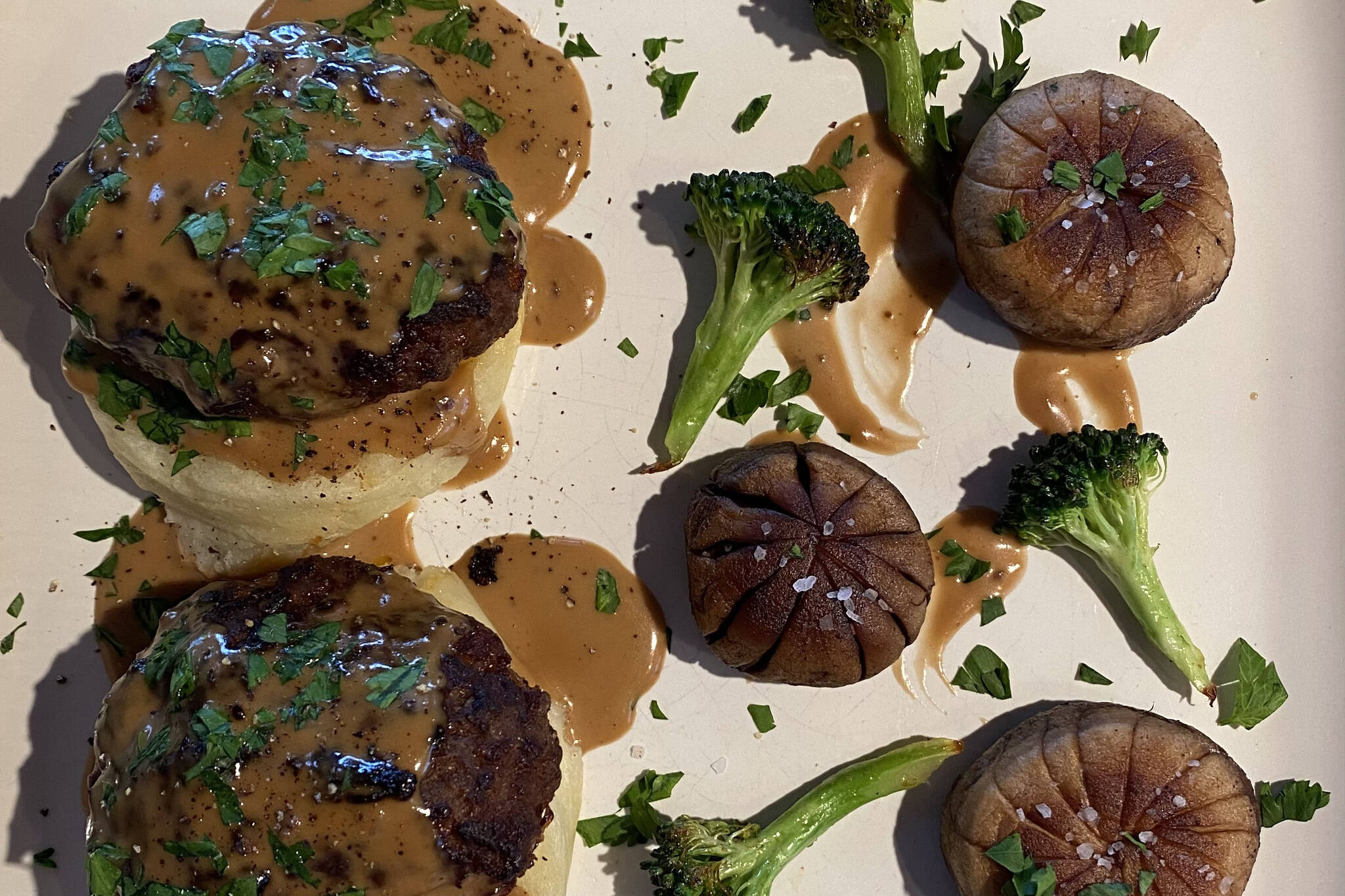 Salisbury steak, a classic of American cuisine, is served with mushrooms and broccoli. (Photo by Tressa Dale/Peninsula Clarion)