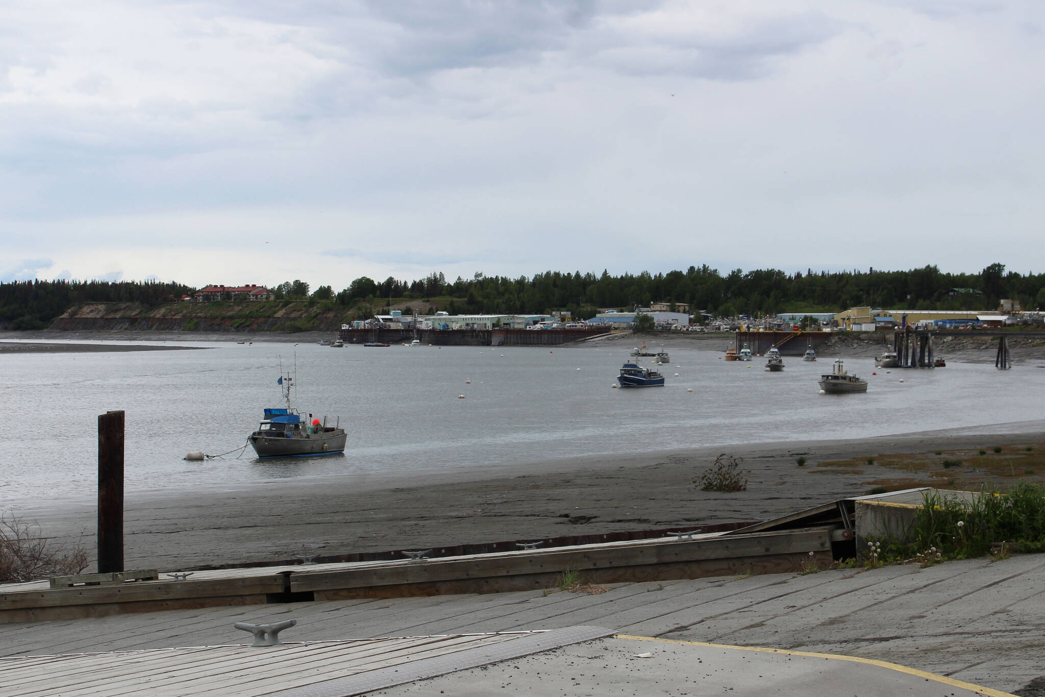 Boats are moored near the Kenai boat launch in Cook Inlet on Friday, June 18, 2021, in Kenai, Alaska. (Ashlyn O’Hara/Peninsula Clarion)