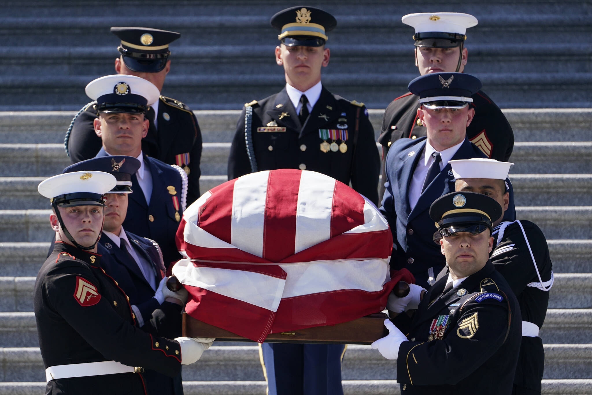 A joint forces honor guard carries the casket of Rep. Don Young, R-Alaska, down the steps of the House of Representatives on Capitol Hill in Washington, Tuesday, March 29, 2022. Young, the longest-serving member of Alaska’s congressional delegation, died Friday, March 18, 2022. He was 88. (AP Photo/Susan Walsh)
A joint forces honor guard carries the casket of Rep. Don Young, R-Alaska, down the steps of the House of Representatives on Capitol Hill in Washington, Tuesday, March 29, 2022. Young, the longest-serving member of Alaska’s congressional delegation, died Friday, March 18, 2022. He was 88. (AP Photo/Susan Walsh)