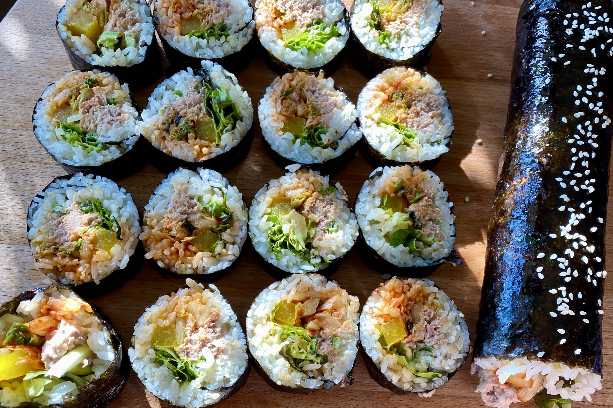 Korean kimbap with tuna, kimchi, lettuce and carrots makes a perfect to-go meal. (Photo by Tressa Dale/ Peninsula Clarion)