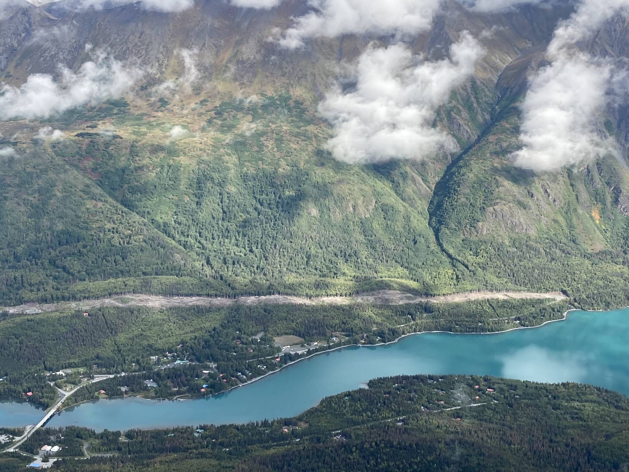 An area cleared to make way for the Cooper Landing Bypass project can be seen above the intersection of the Kenai River and Kenai Lake in Cooper Landing, Alaska, on Sept. 6, 2021. (Photo by Jeff Helminiak/Peninsula Clarion)