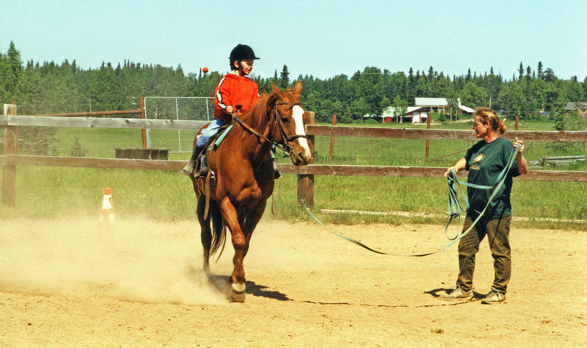 Photo by Clark Fair 
Abby (Lancashire) Ala, seen here giving riding lessons in the early 2000s, was just a child when her mother befriended Miriam Mathers. Ala now lives on a portion of the old Mathers homestead.