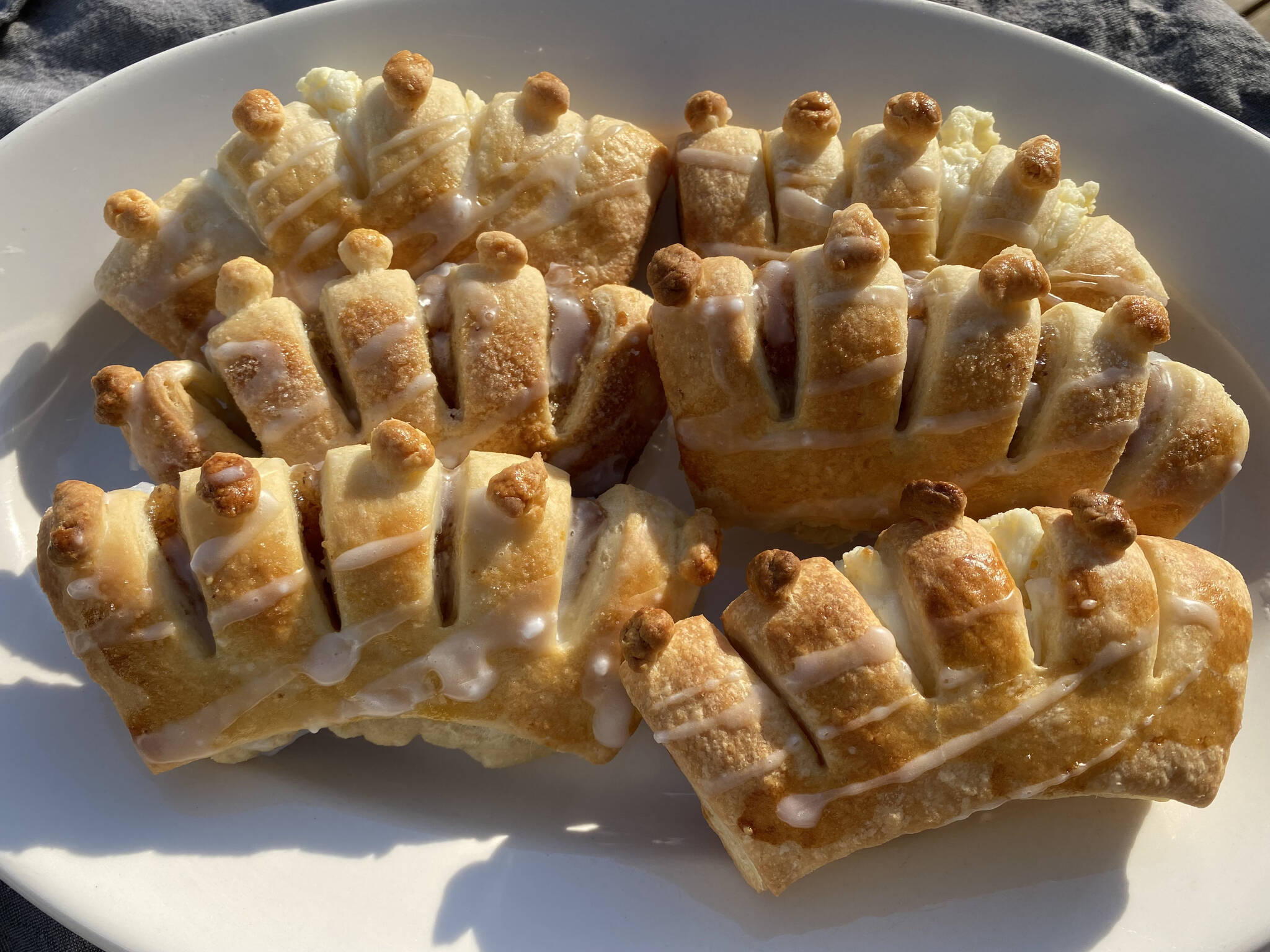 Buttery bear claws are filled with almond paste and topped with sugar glaze. (Photo by Tressa Dale/Peninsula Clarion)